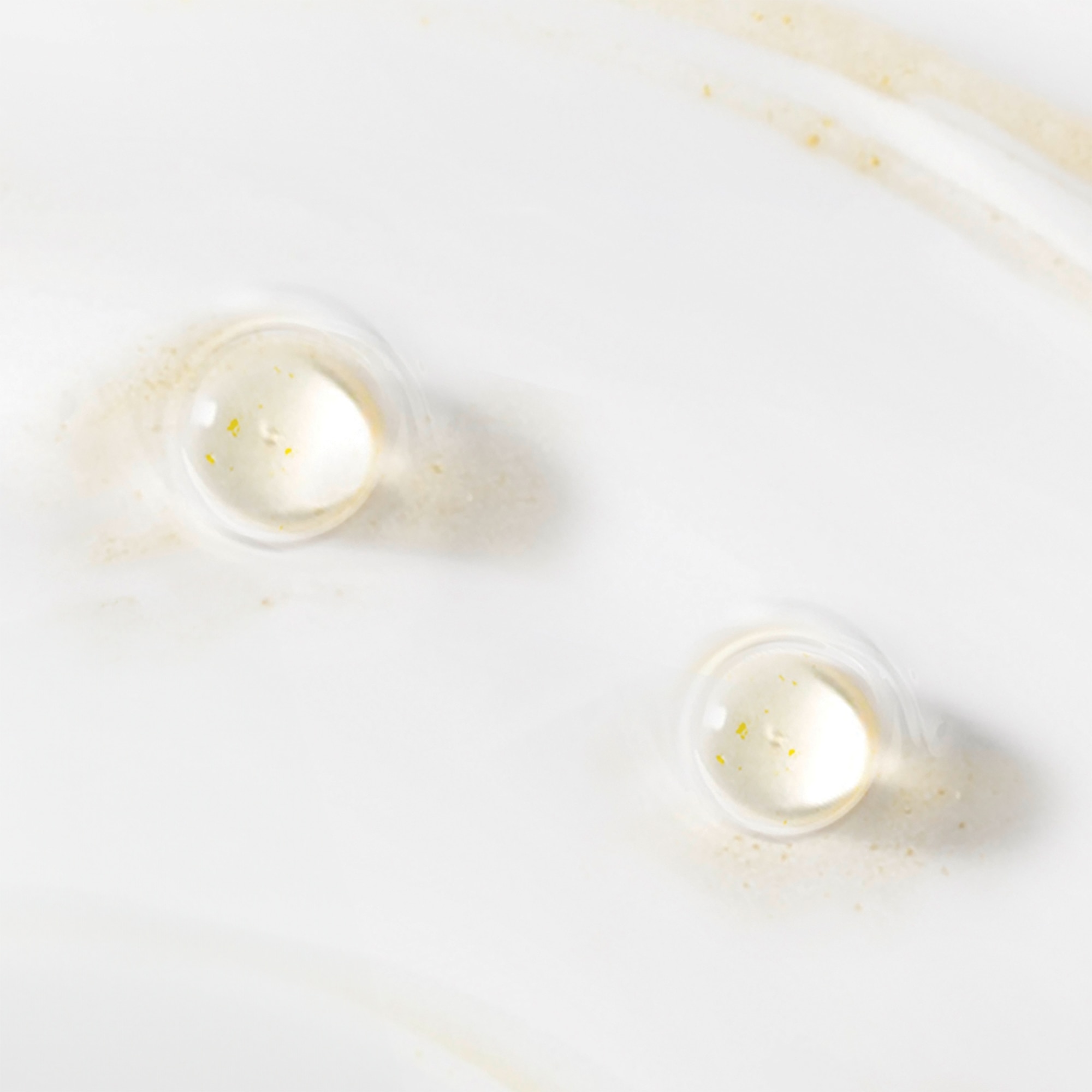 Close-up texture shot showing bubbles and creamy liquid