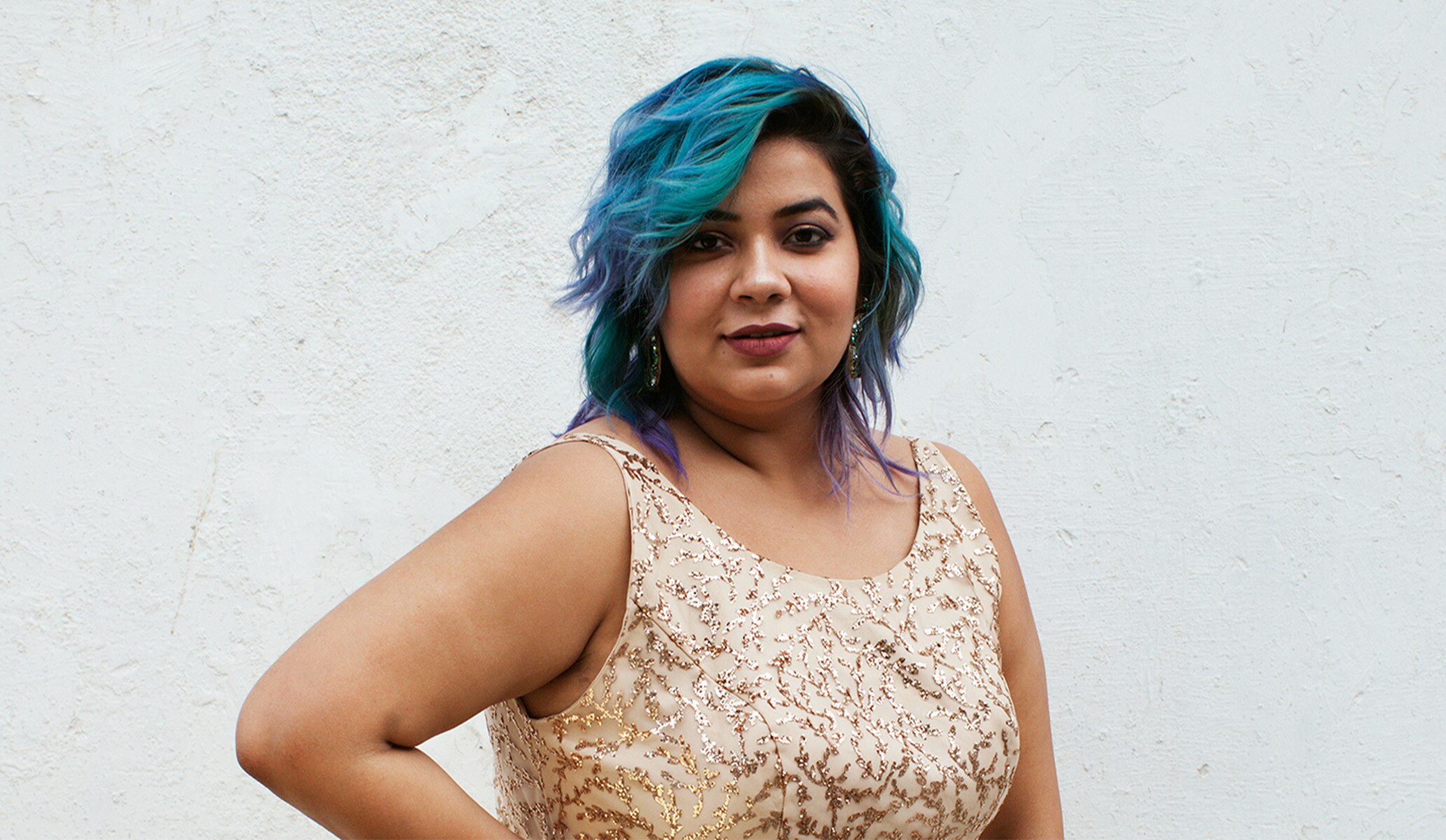 Woman with blue hair smiling