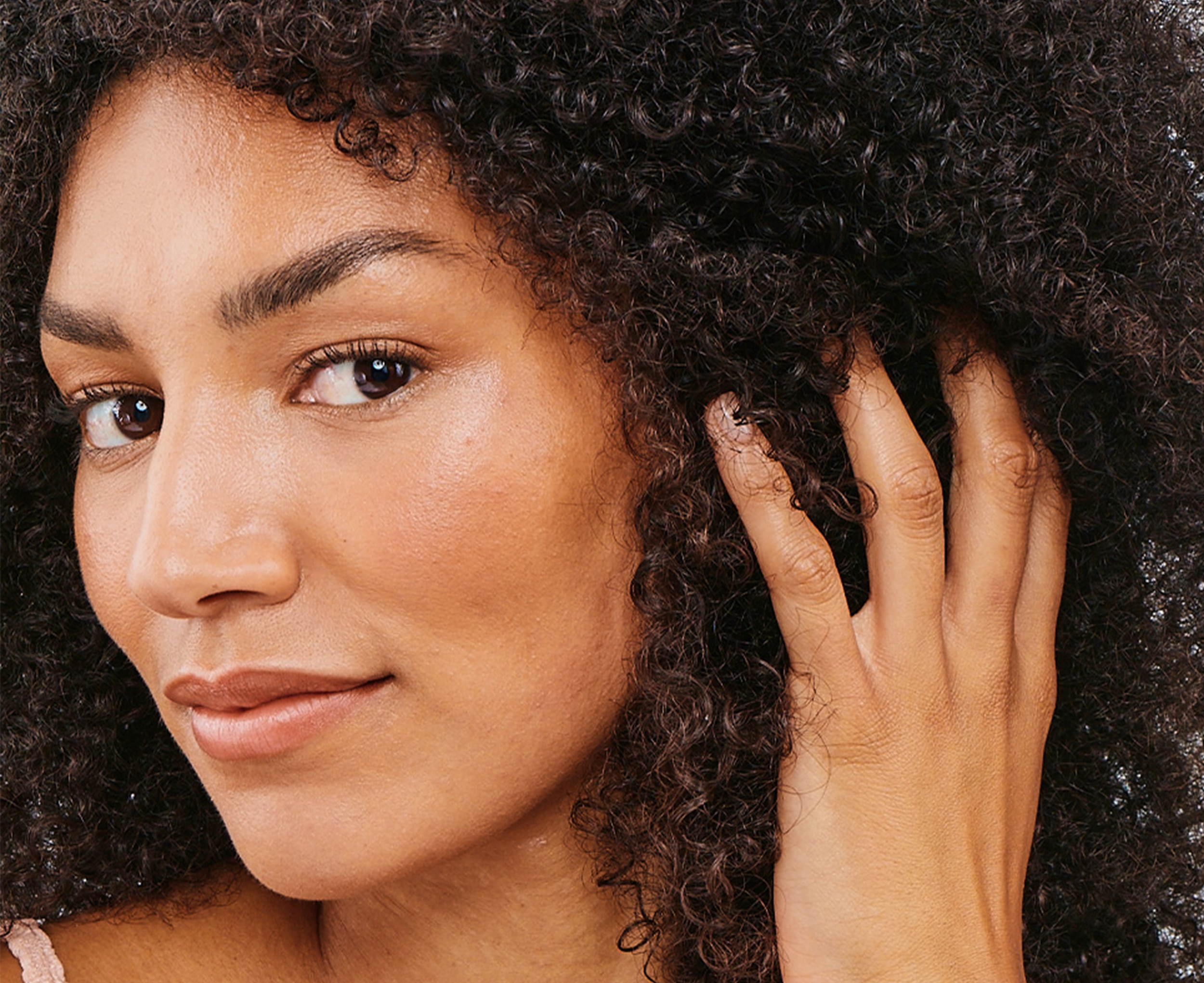 Image of a woman with afro curly hair