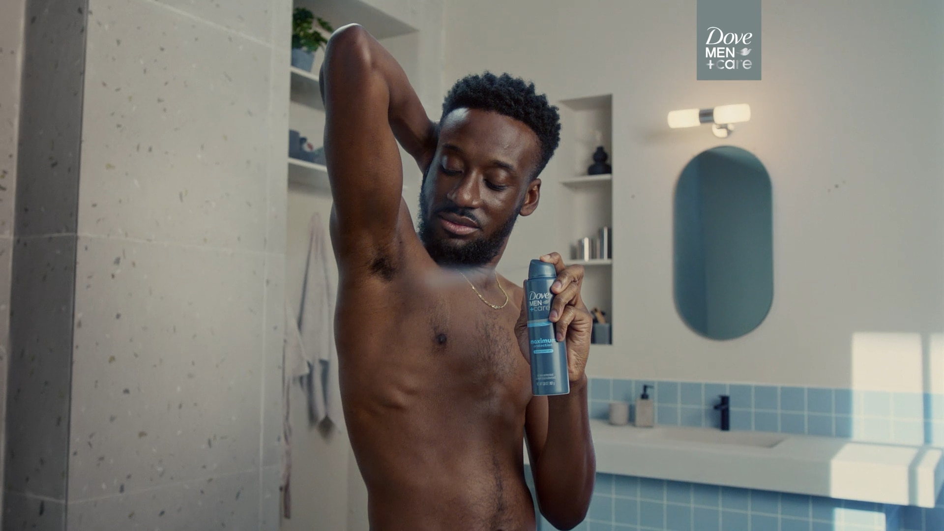 Man spraying Dove Men+Care Maximum Protection Dry Spray