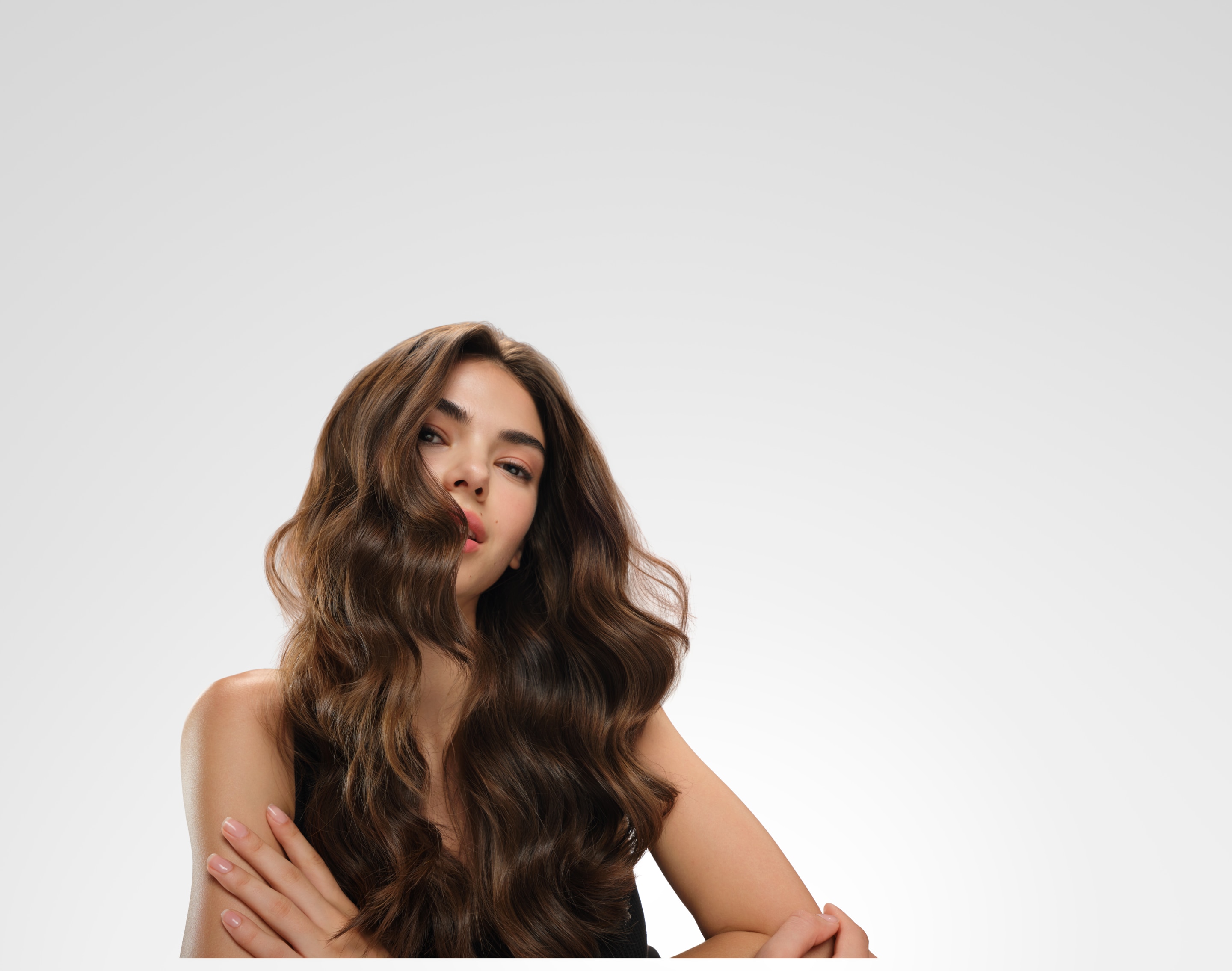 a model with straight black hair styled in a updo