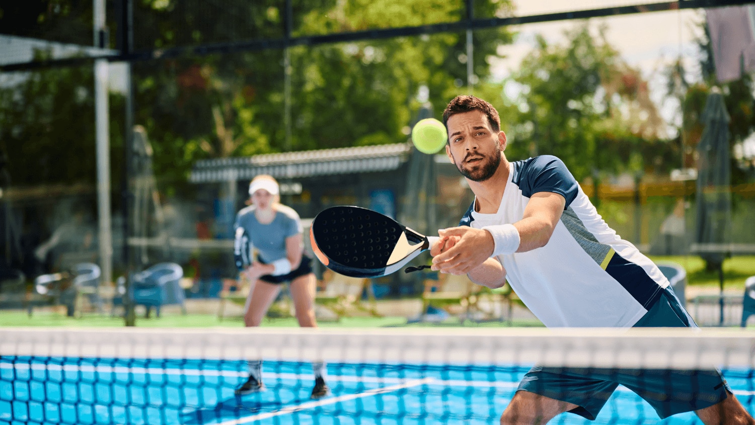 Young man playing padel with no sign of excessively sweaty hands 