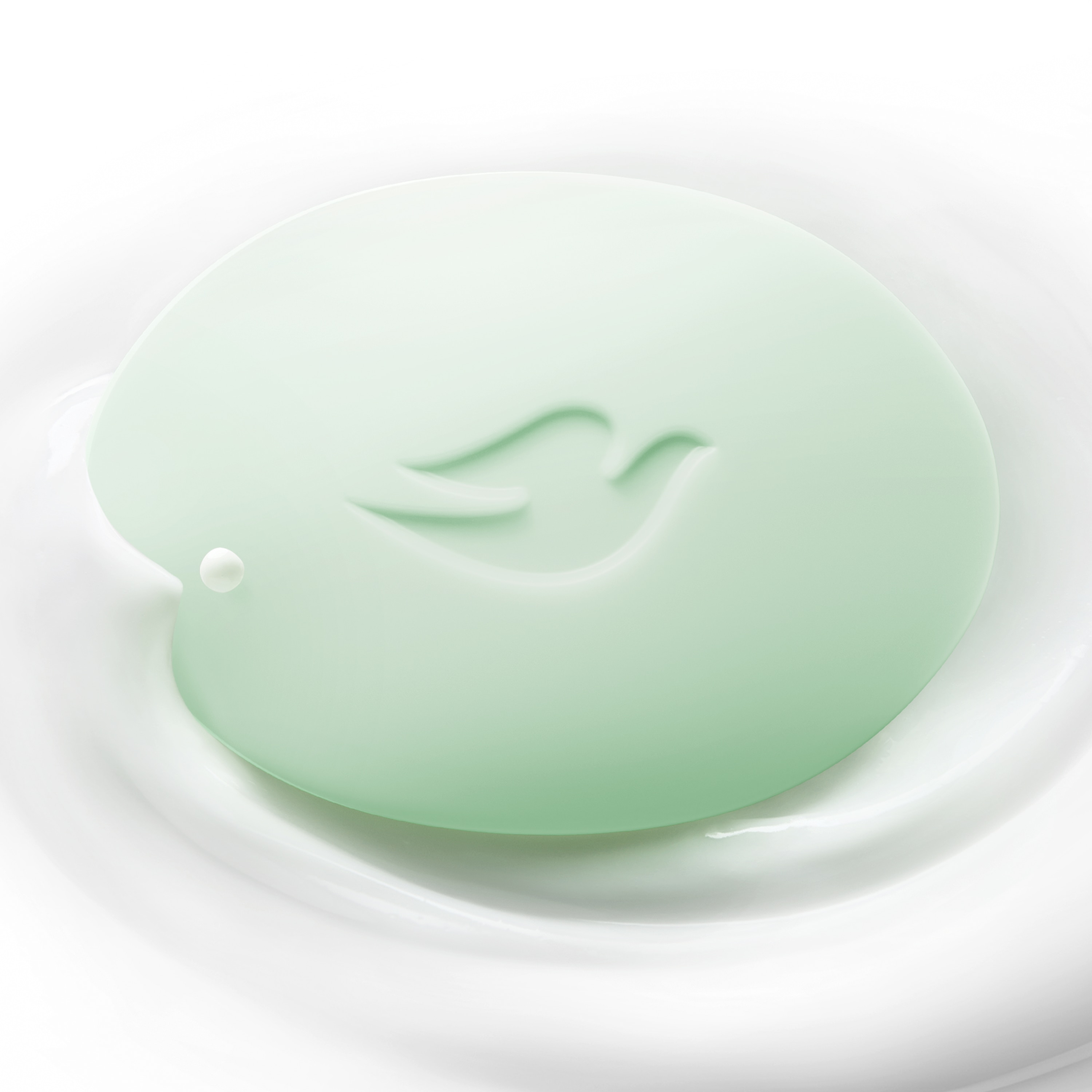 Whispering Wisteria body wash against a purple background with a white plate and purple beads  in the corner. 