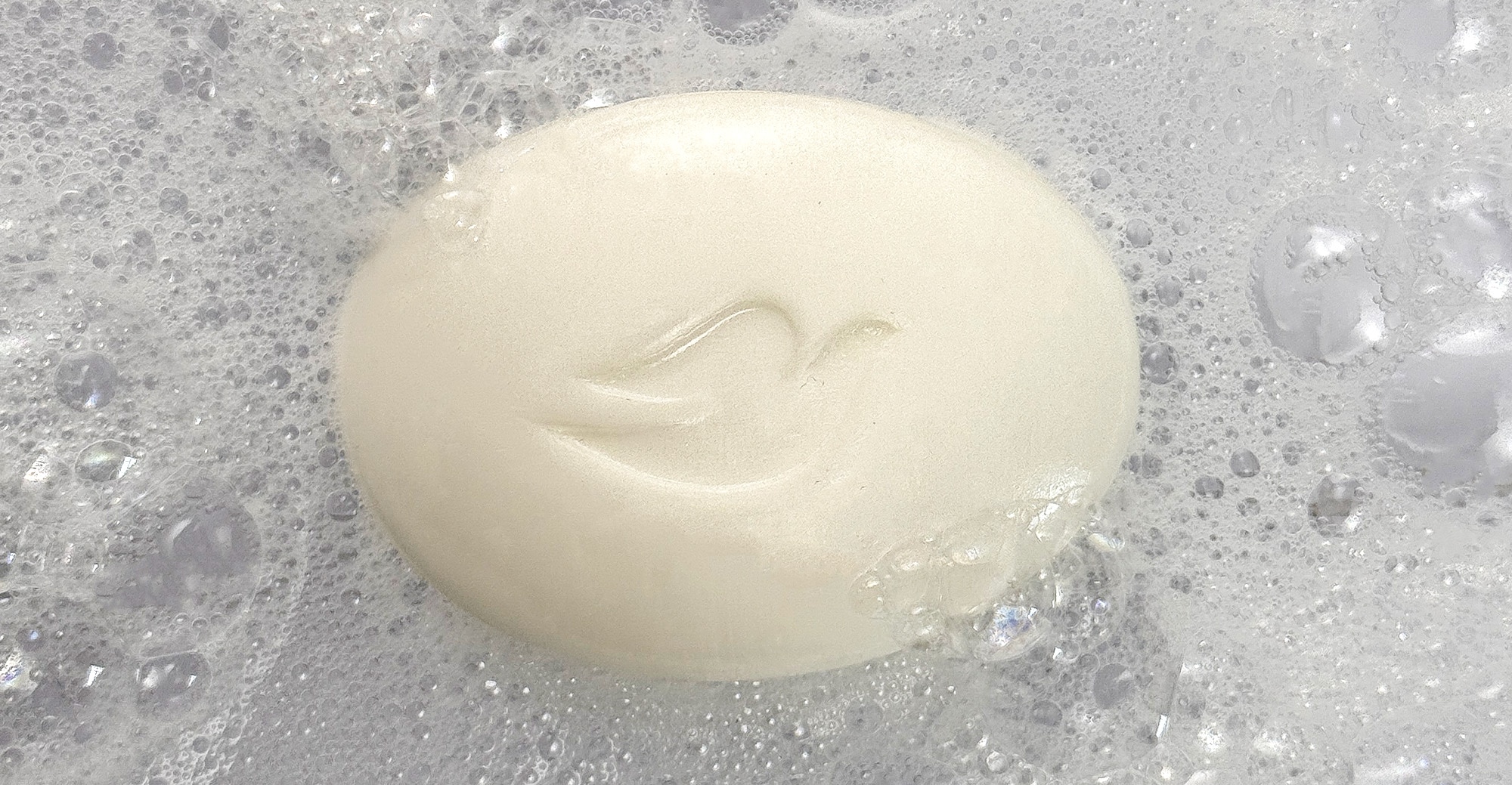 Product in use shot of a Dove Beauty Bar product