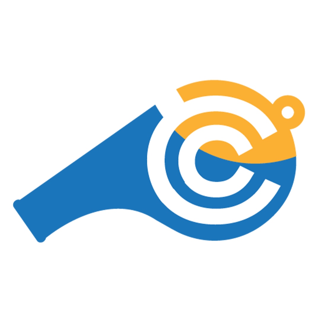 A woman and three children playing field hockey on a grassy court