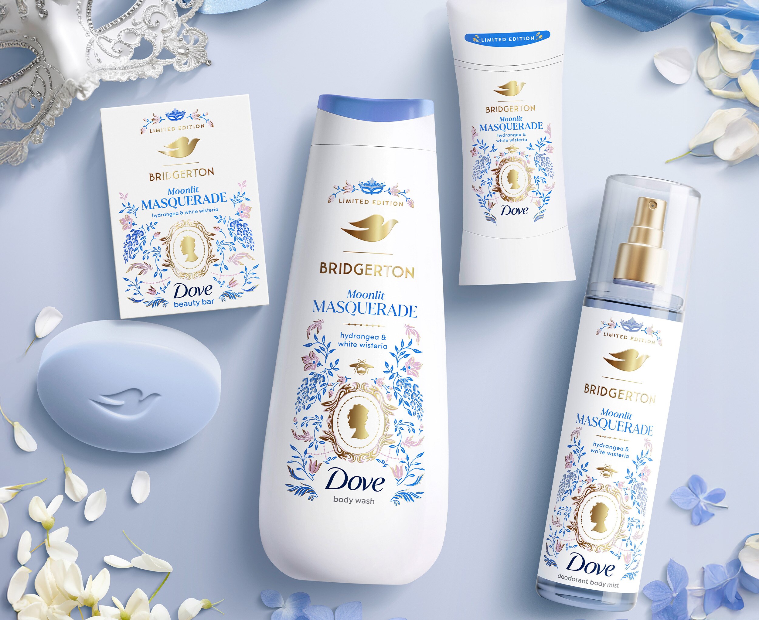 Dove Intensive Repair Shampoo, Conditioner, Hair Mask and Hair Serum laying flat against a white background 