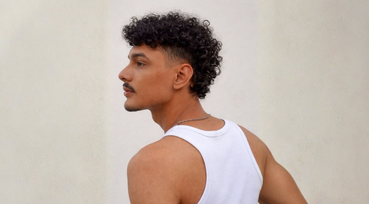 6. Curly Hair Mullet