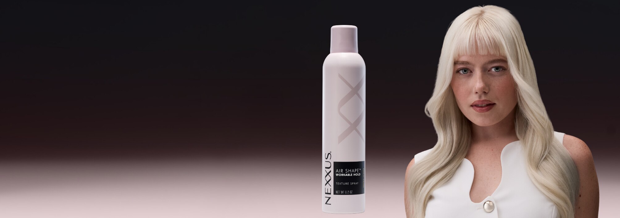 A woman with beautiful, voluminous hair next to Nexxus AIR SHAPE™ TEXTURE SPRAY bottle