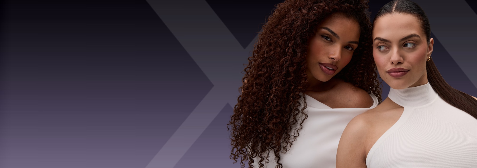 Two individuals wearing white outfits with distinct hairstyles. One has voluminous curly hair, and the other has sleek straight hair pulled back. The background is a gradient of dark purple to black, creating a modern and stylish aesthetic.