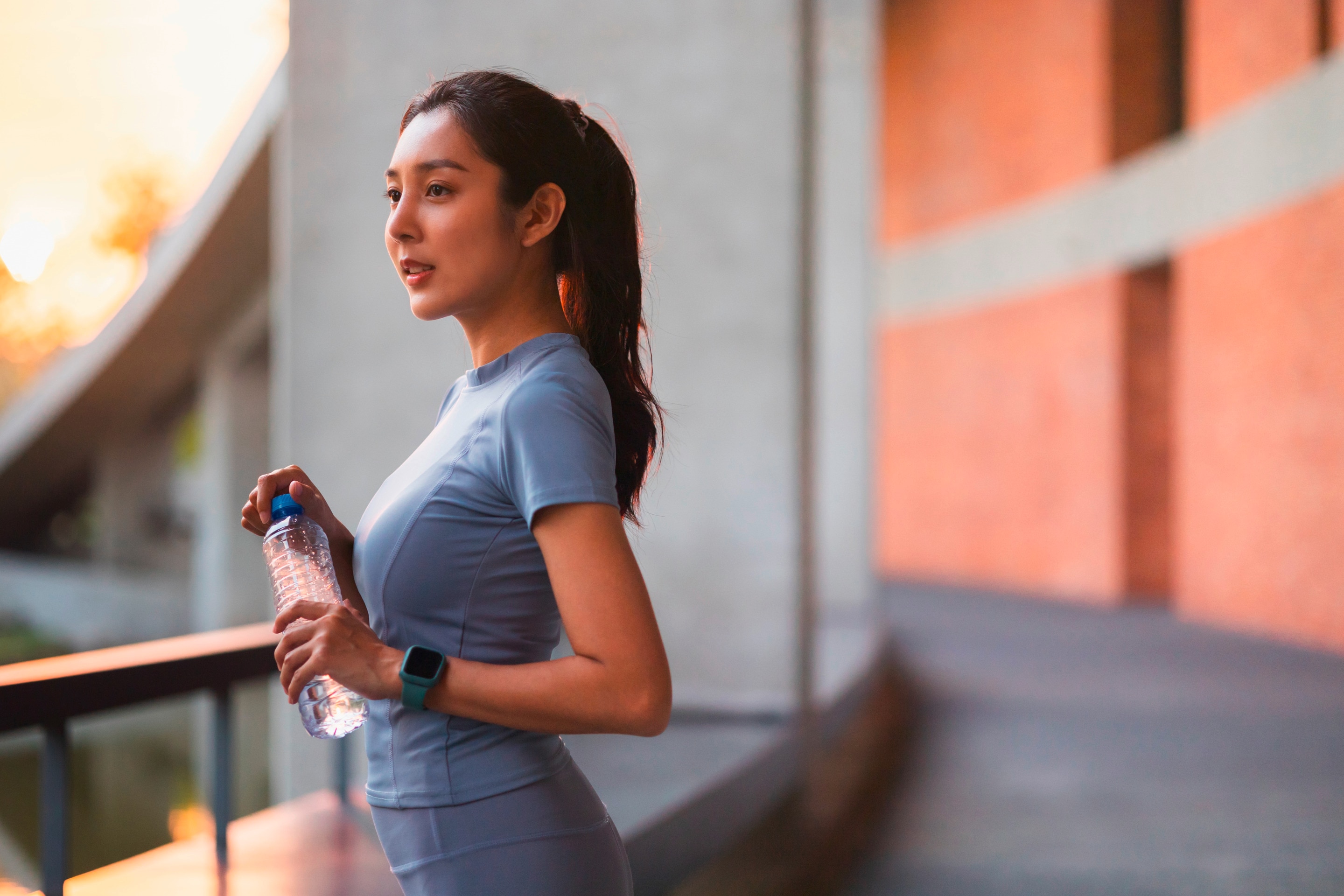 Woman in workout clothes looking at the distance.