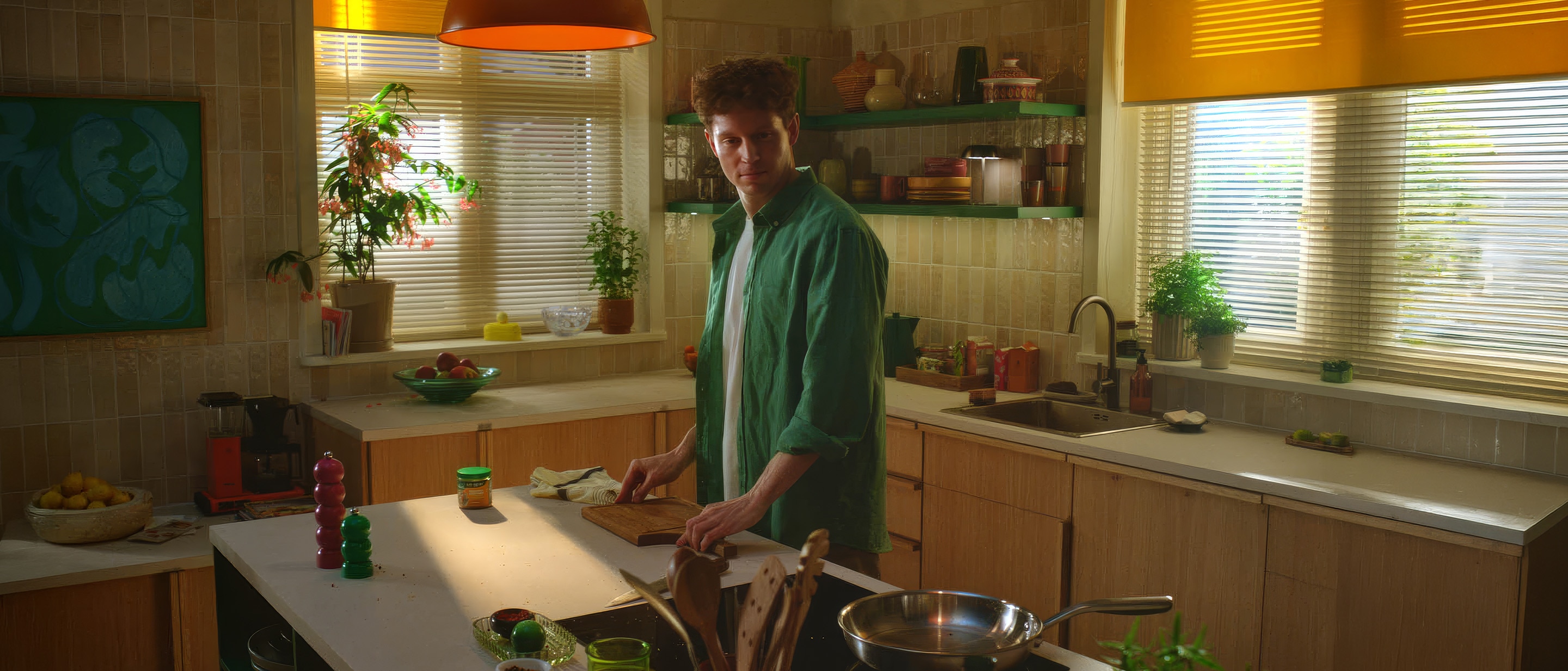 A man standing in kitchen for cooking.
