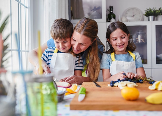 Mom and kids creating edible art with Popsicle® ice pops