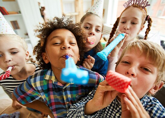 Five children enjoying edible art activities with Popsicle® ice pops