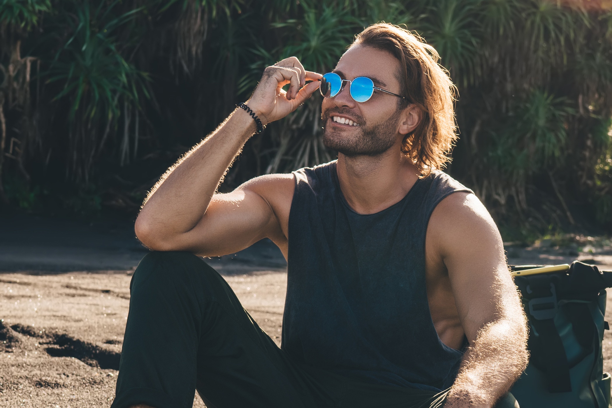 Young hipster Gen Z male in a tank top with no sign of itchy armpits