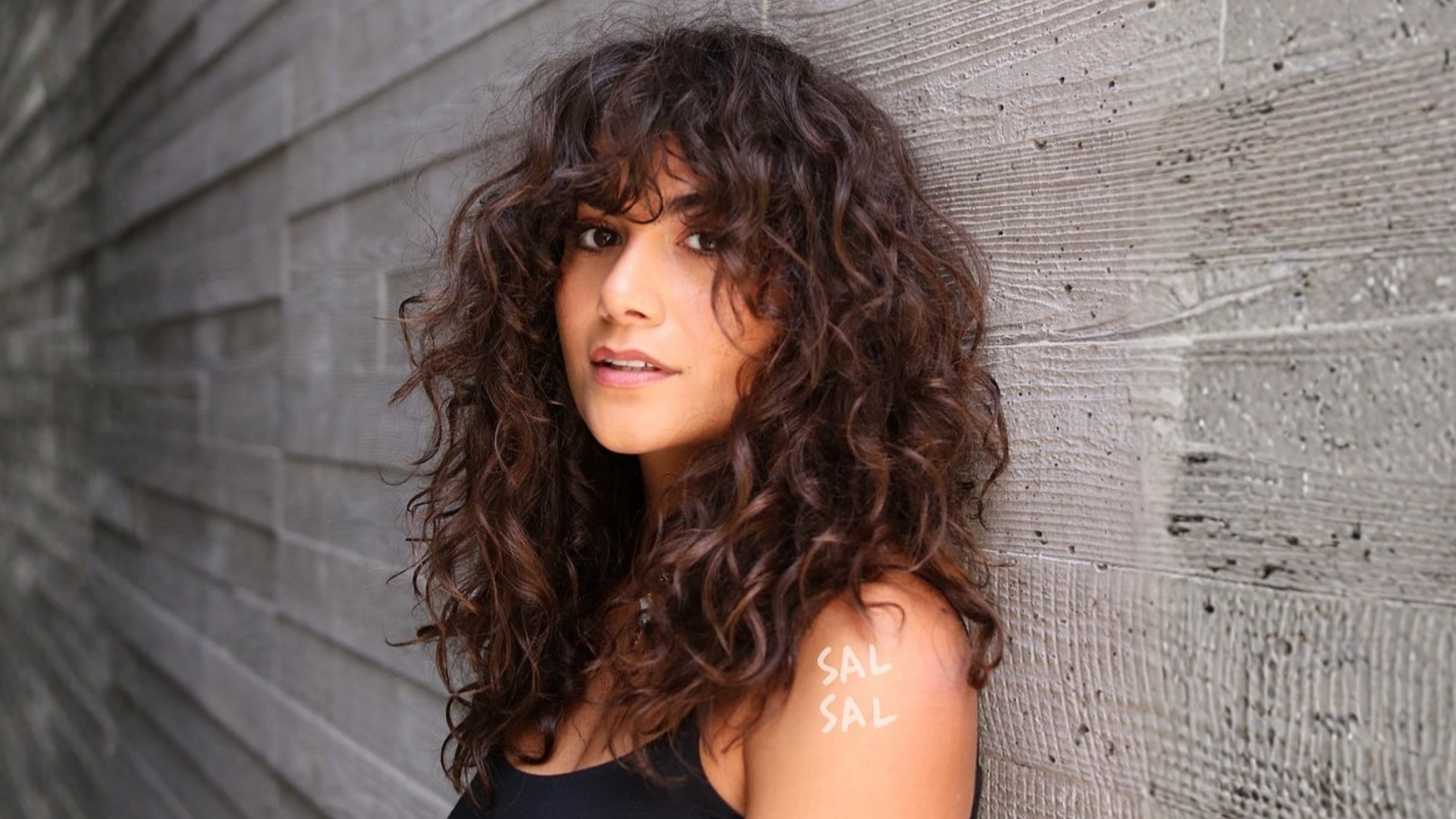 10. Curly Layered Fringe