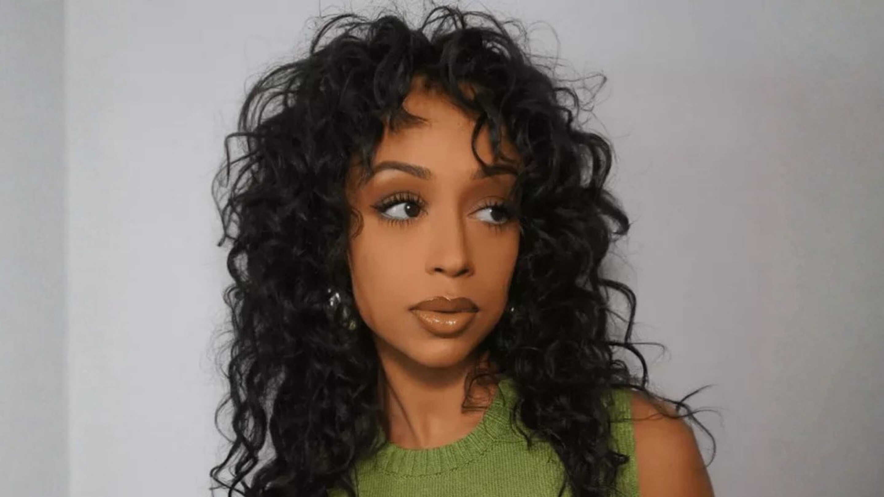 1. Layered Curly Cut