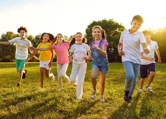 Kids having fun outdoors in summer