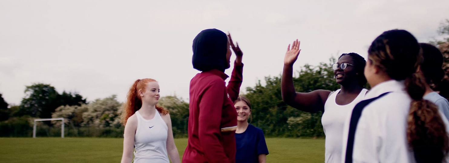 Kids playing baseball outdoors together