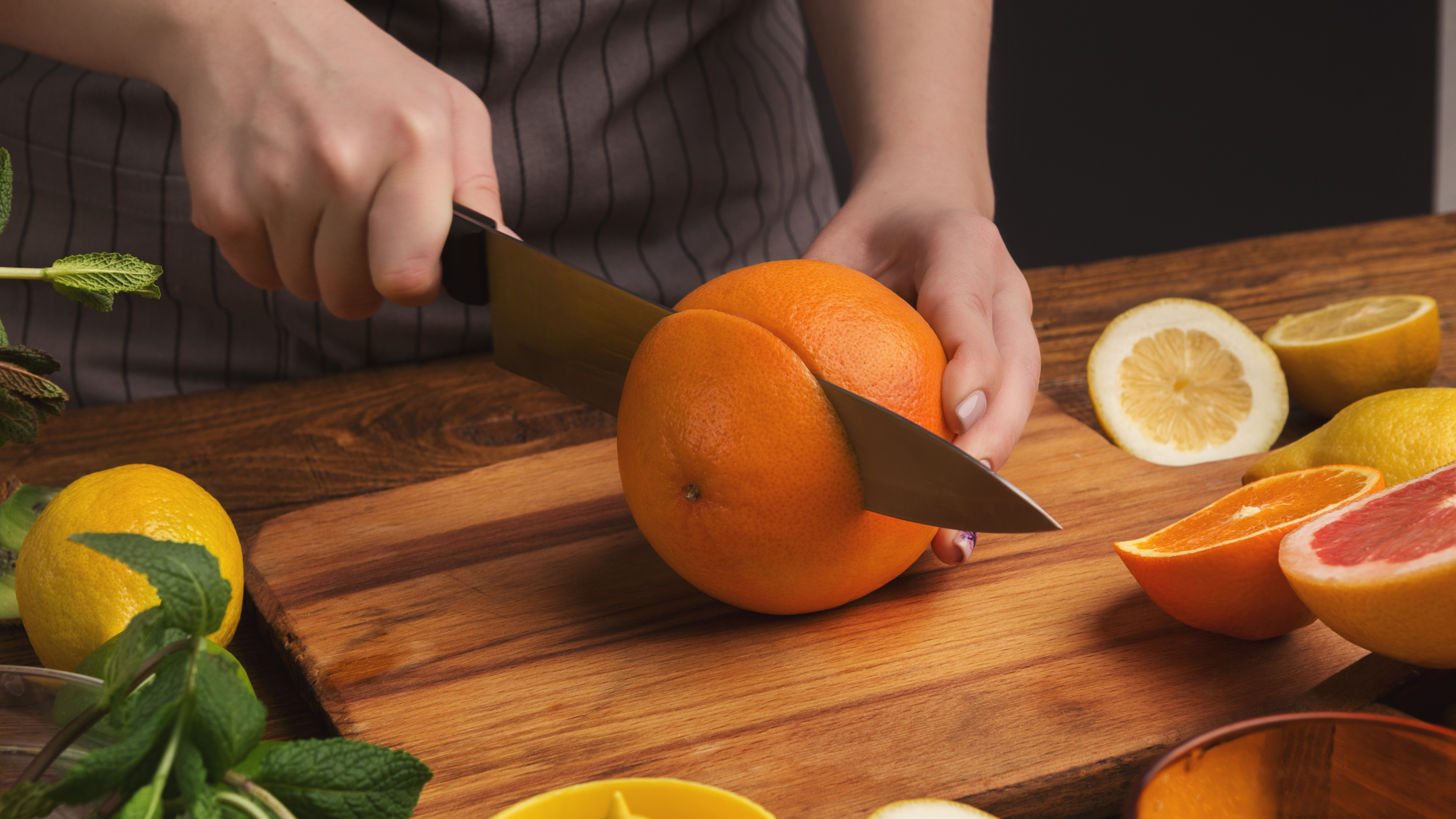 Step 3: Cut the Oranges in Half Image
