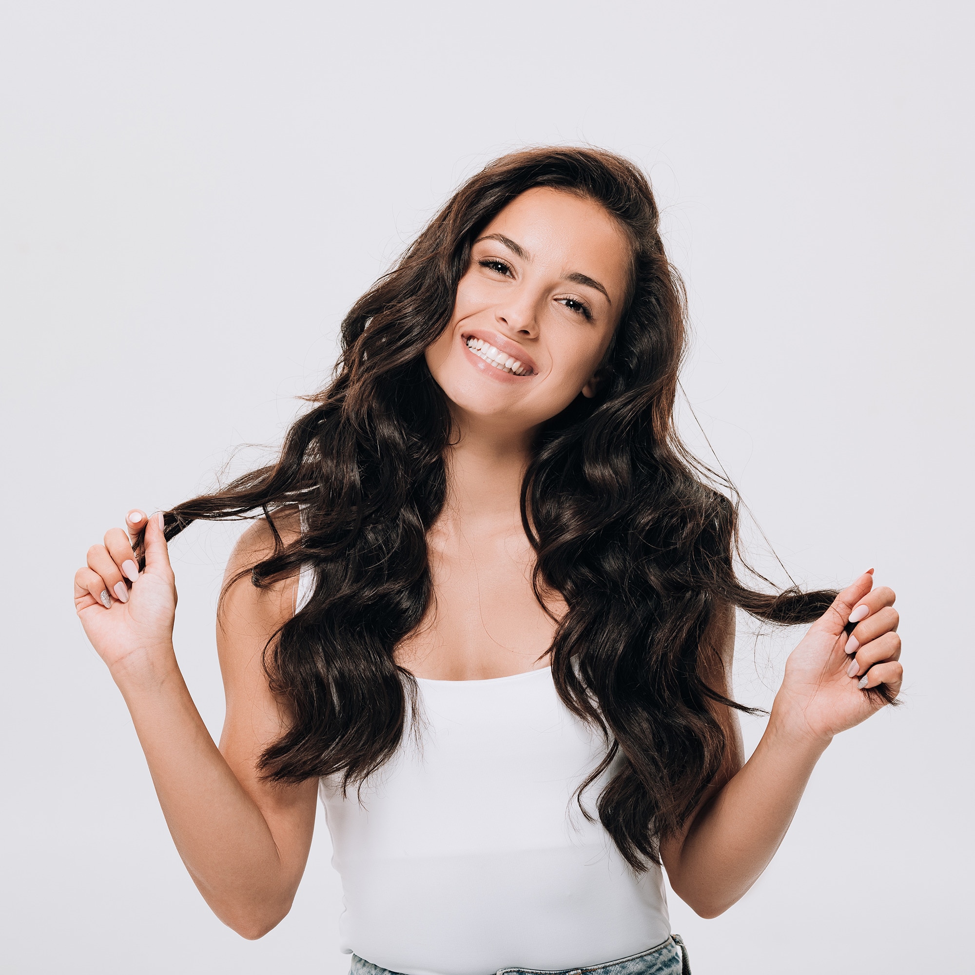 Women with shiny, strong hair after using bond-repair treatment products