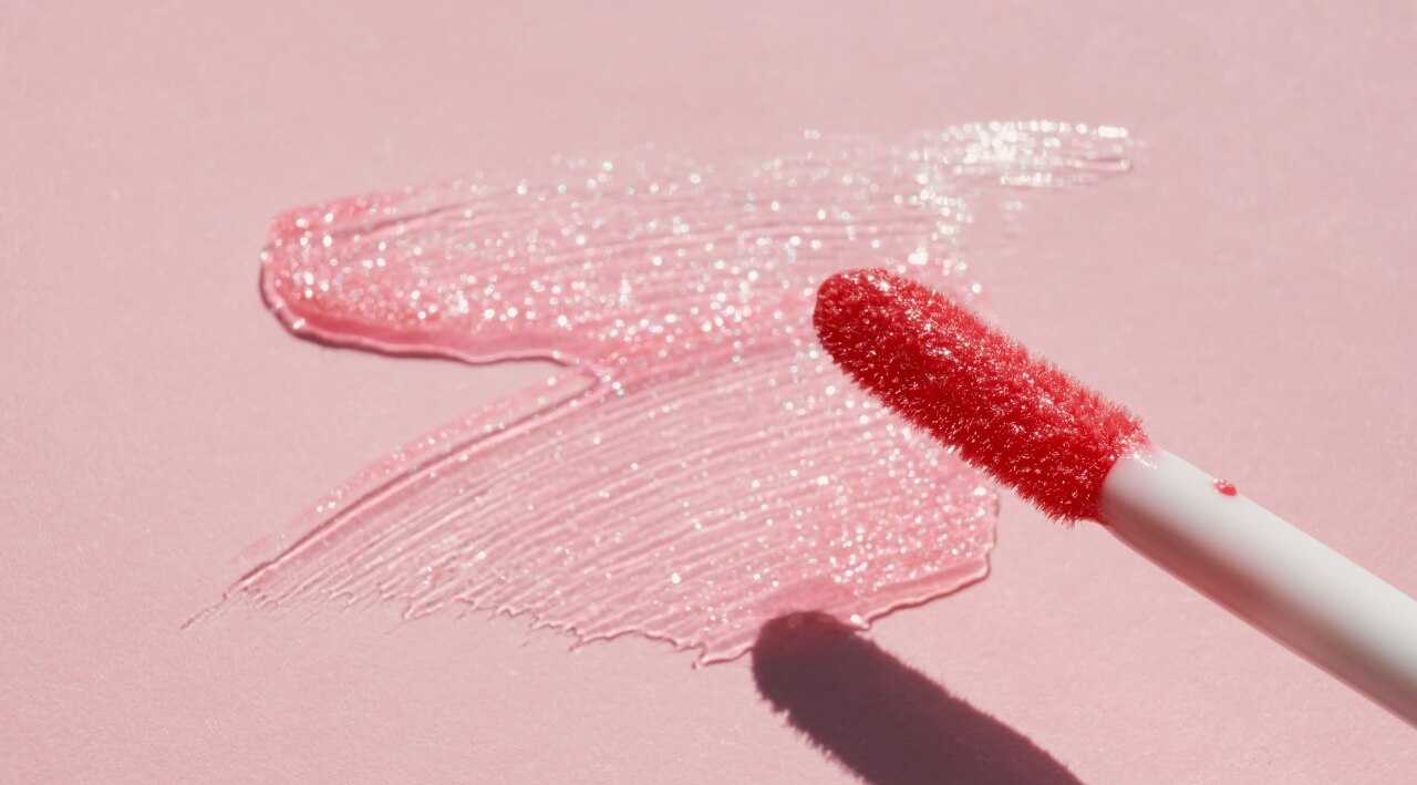 Glossy lips complete the look