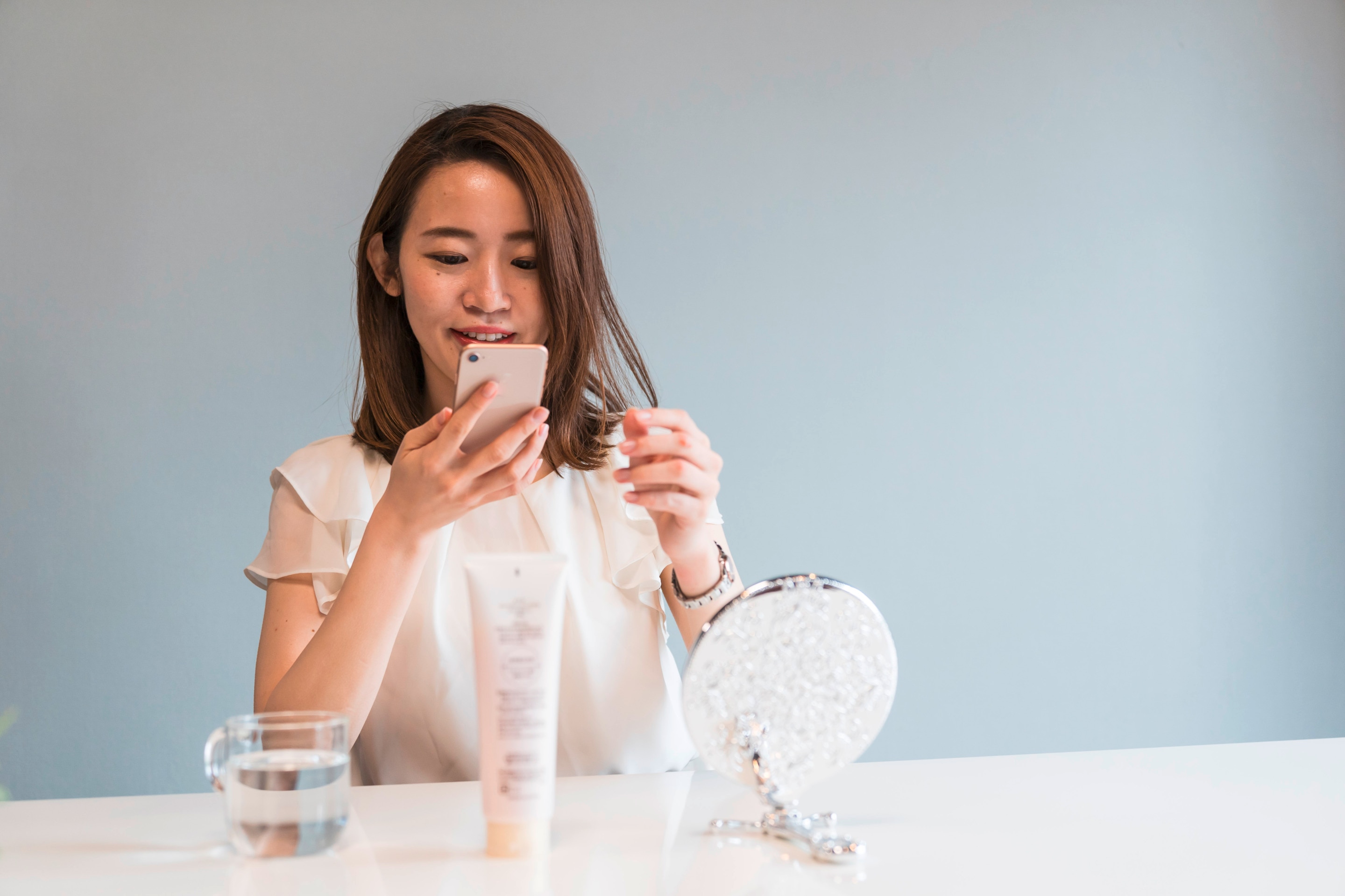 Woman checking skintok before doing her skincare.