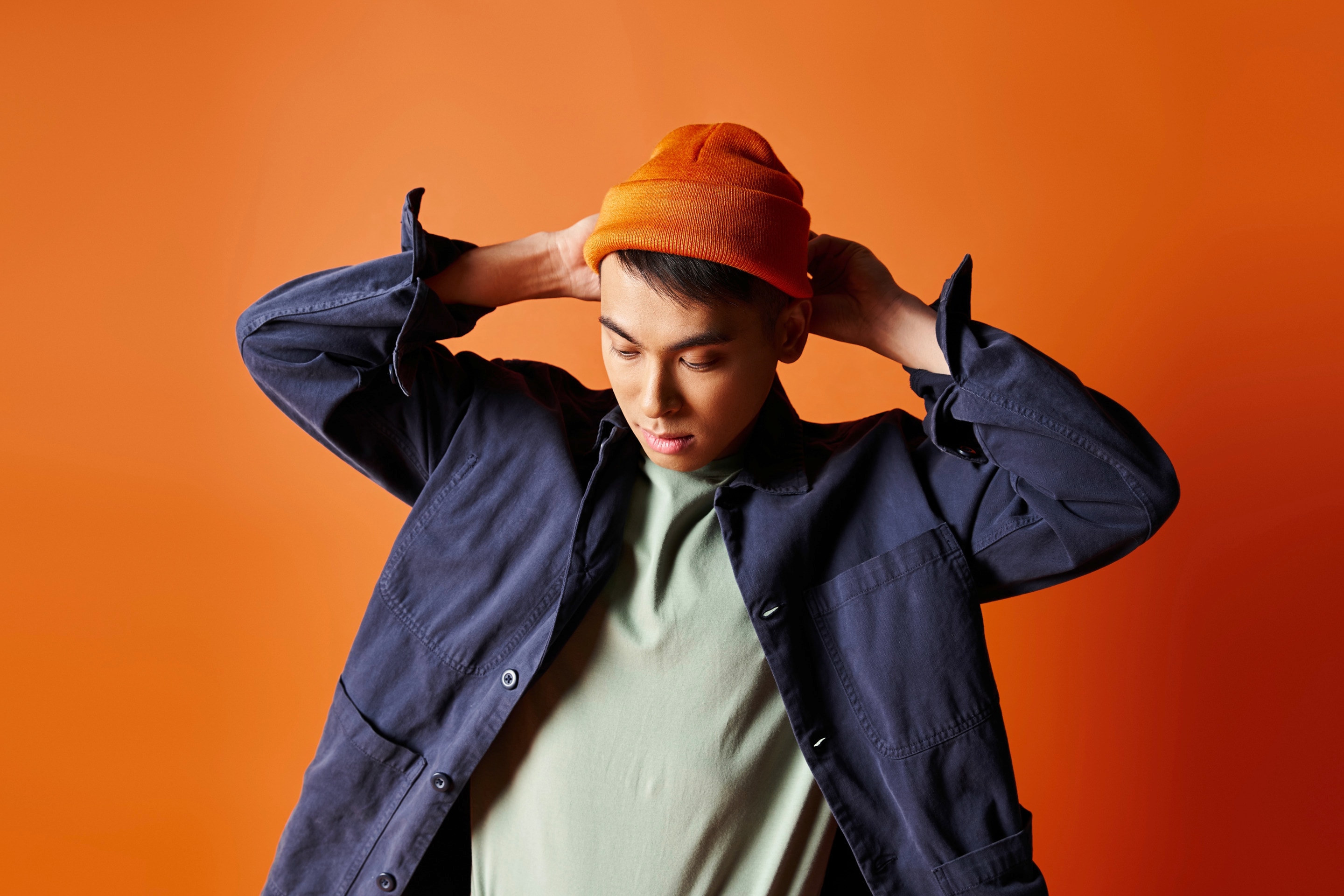 A young man wears a trendy outfit.