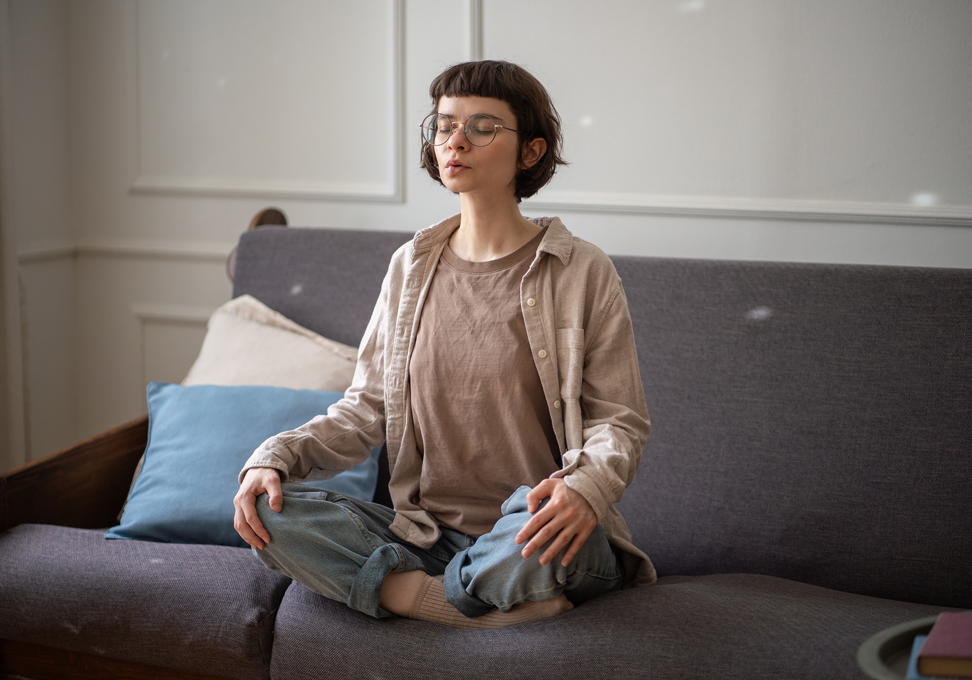 Woman doing breathwork exercises for stress at home