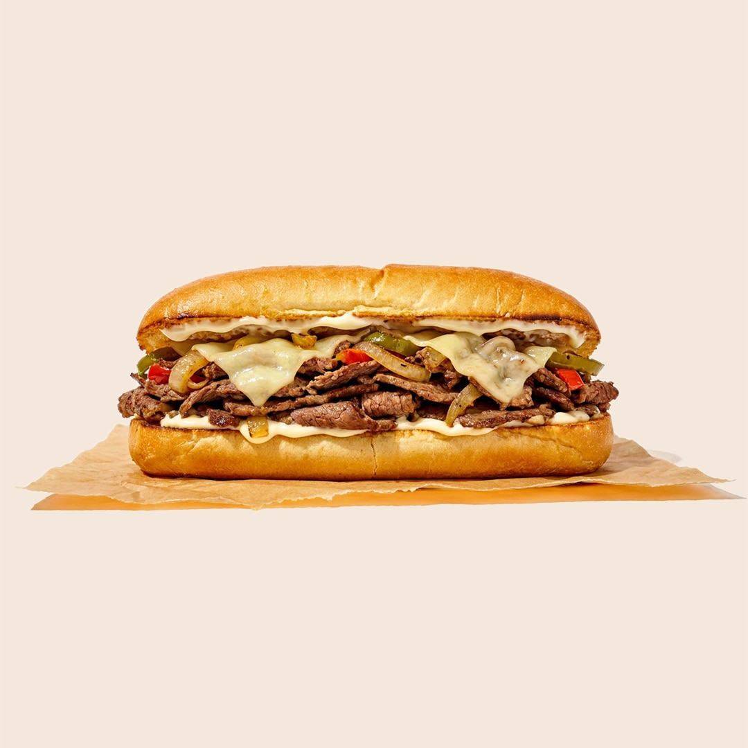 Classic Philly cheesesteak sub with thinly sliced steak, melted cheese, peppers, onions and mayo.