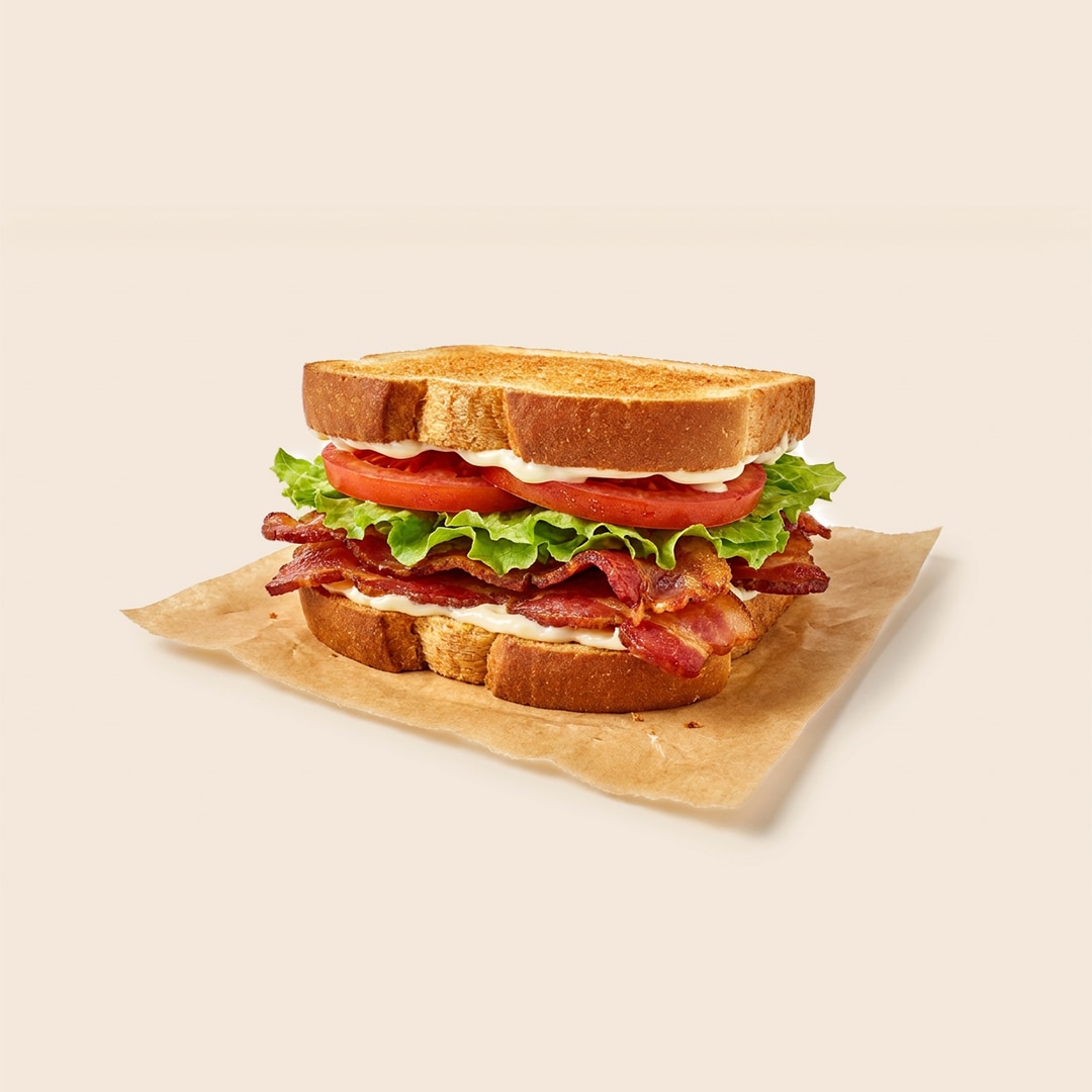 Classic BLT sandwich with crispy bacon, lettuce, tomato, and mayo on toasted bread.