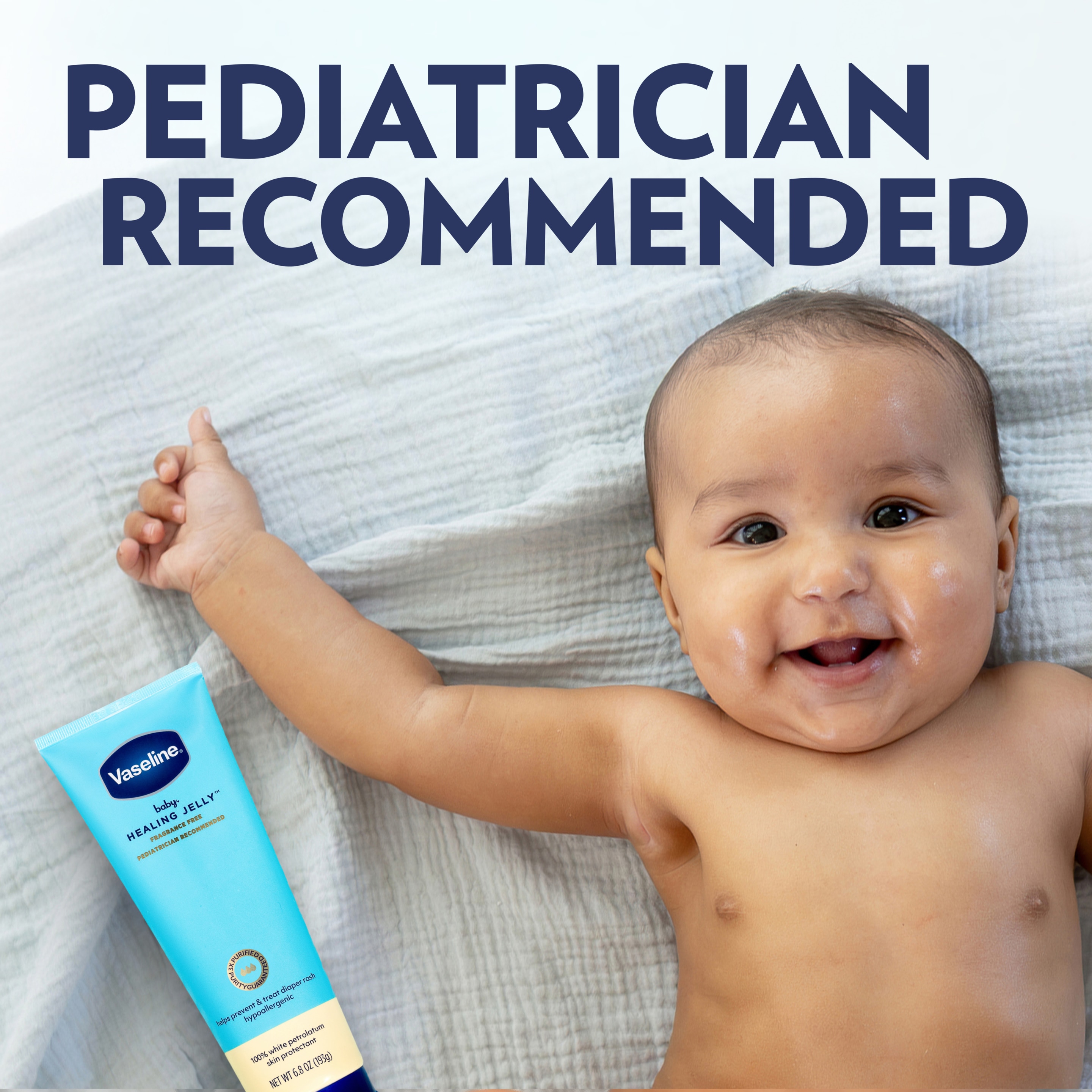 A Vaseline Baby Healing Jelly tube next to a baby lying on a light blanket, with text