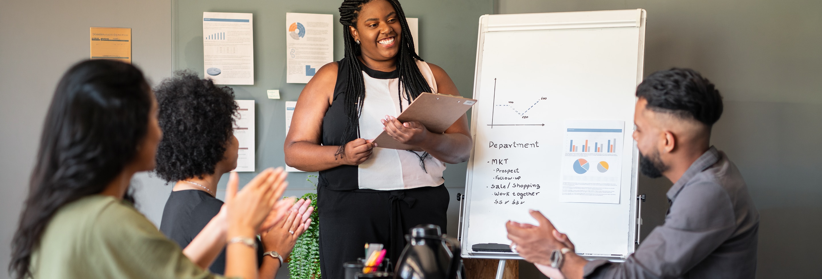 Woman staying calm under pressure while giving presentation in the office 