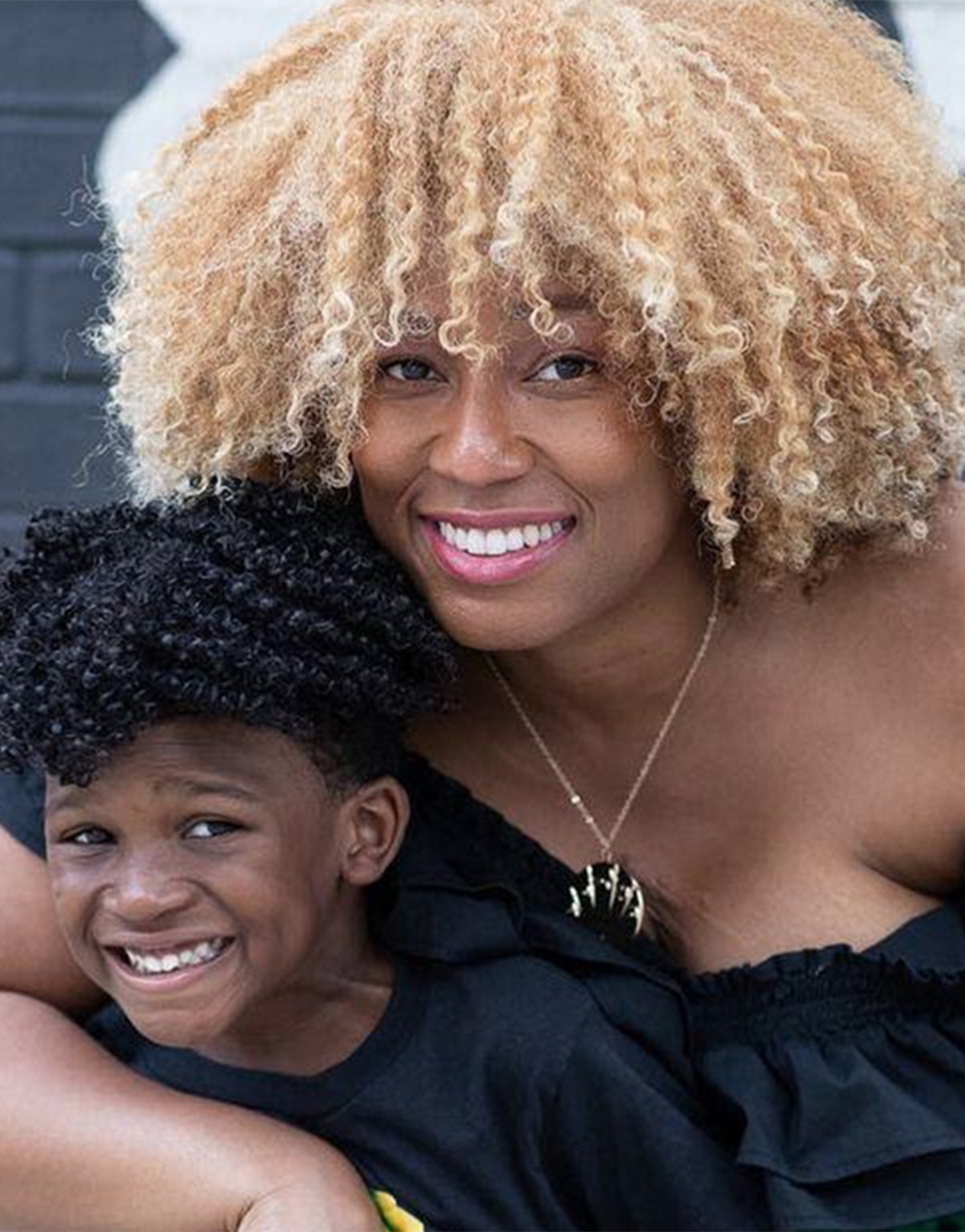 Mother and son smiling 