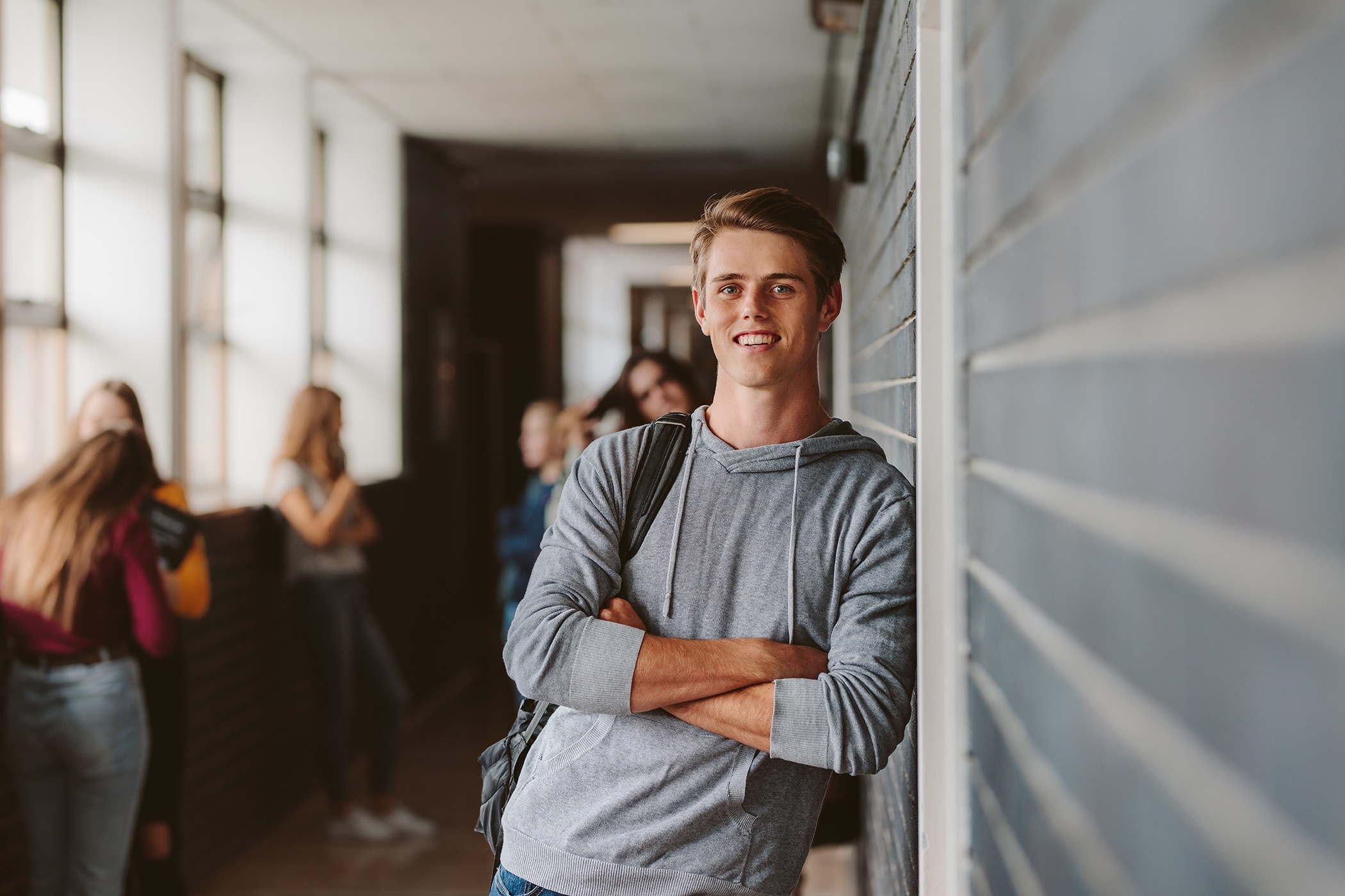 College student smiling and confident because he knows how to stay fresh in college
