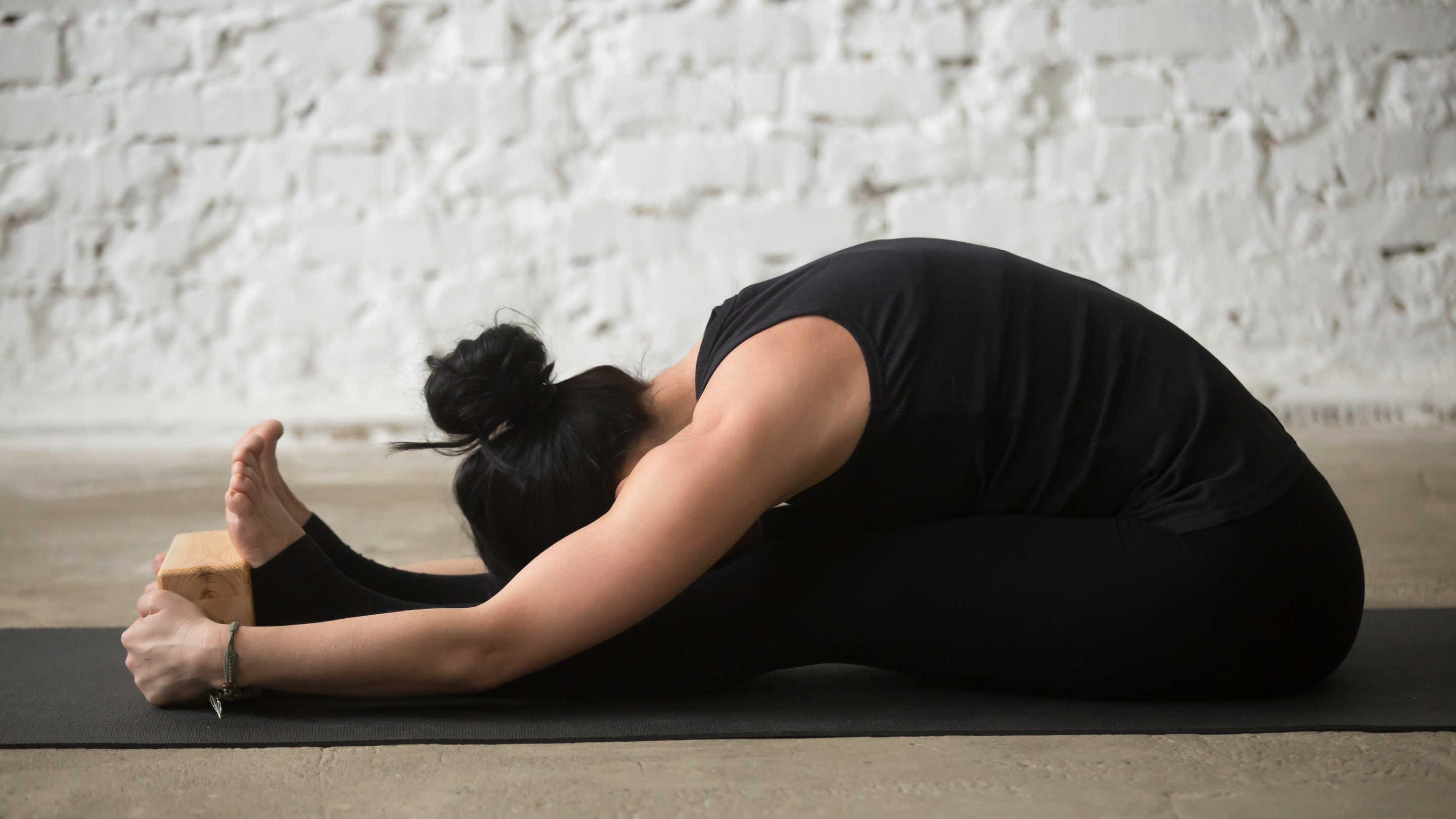 3. Paschimottanasana (Seated Forward Bend)