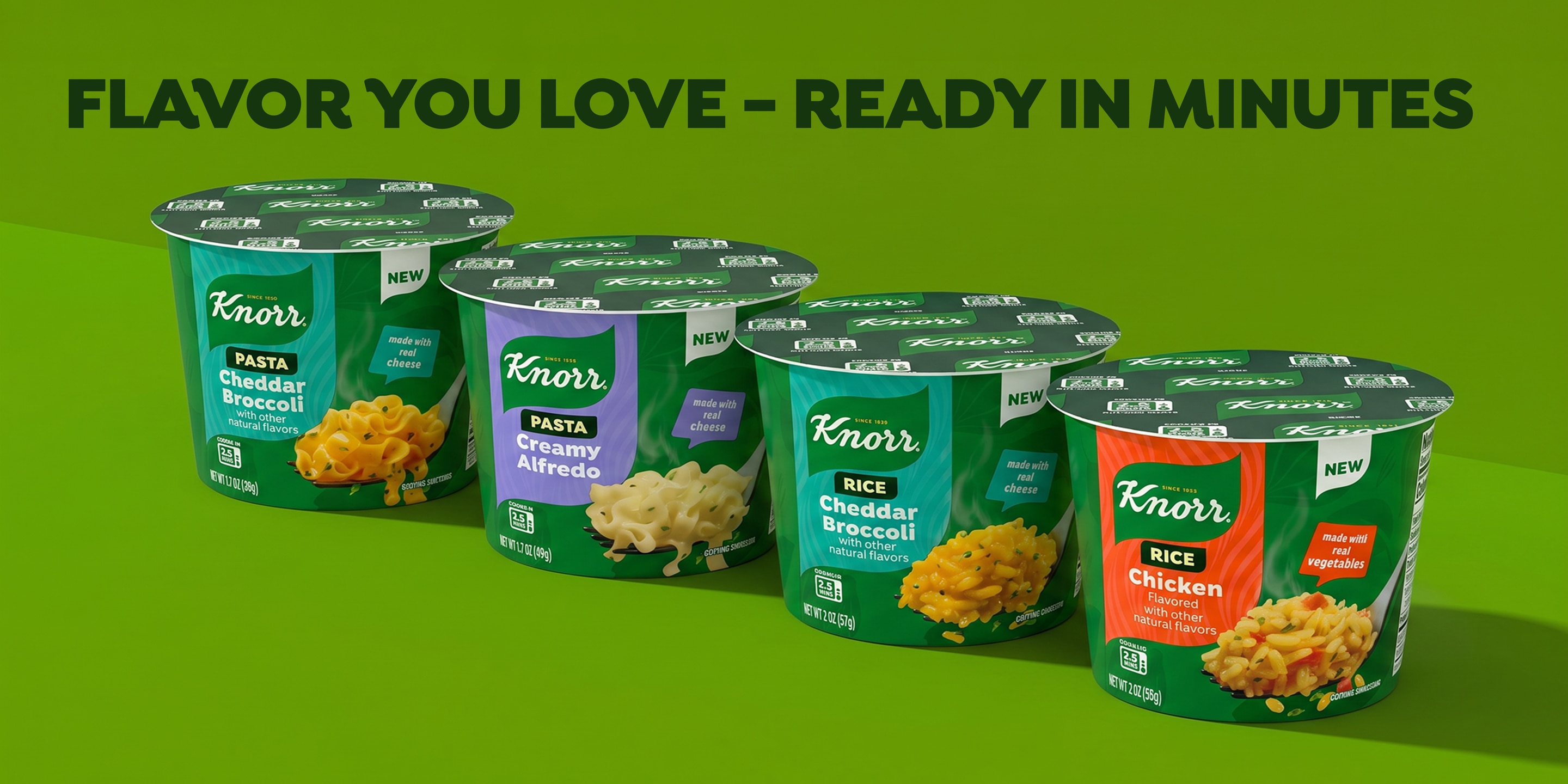Four cups of Knorr rice & pasta cups with different flavors are arranged on a green background. 