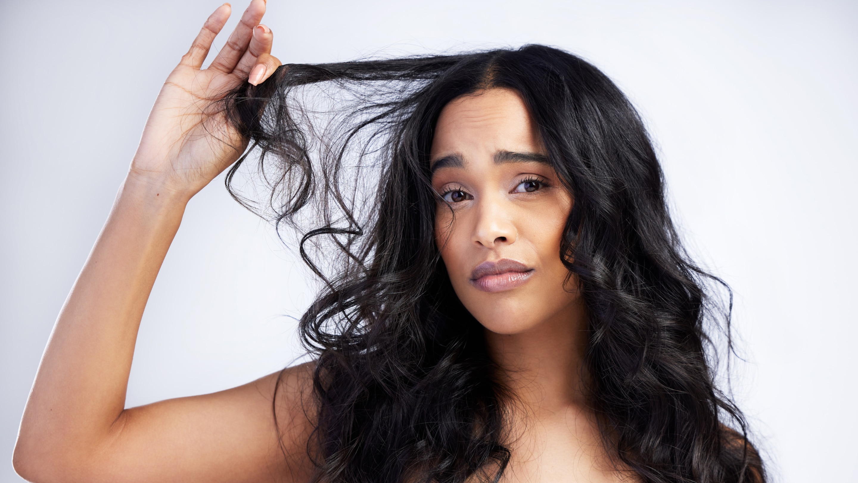 linking article: 30+ Haircuts for Frizzy Hair: Styles That Help Reduce Frizz + Hair Care Tips