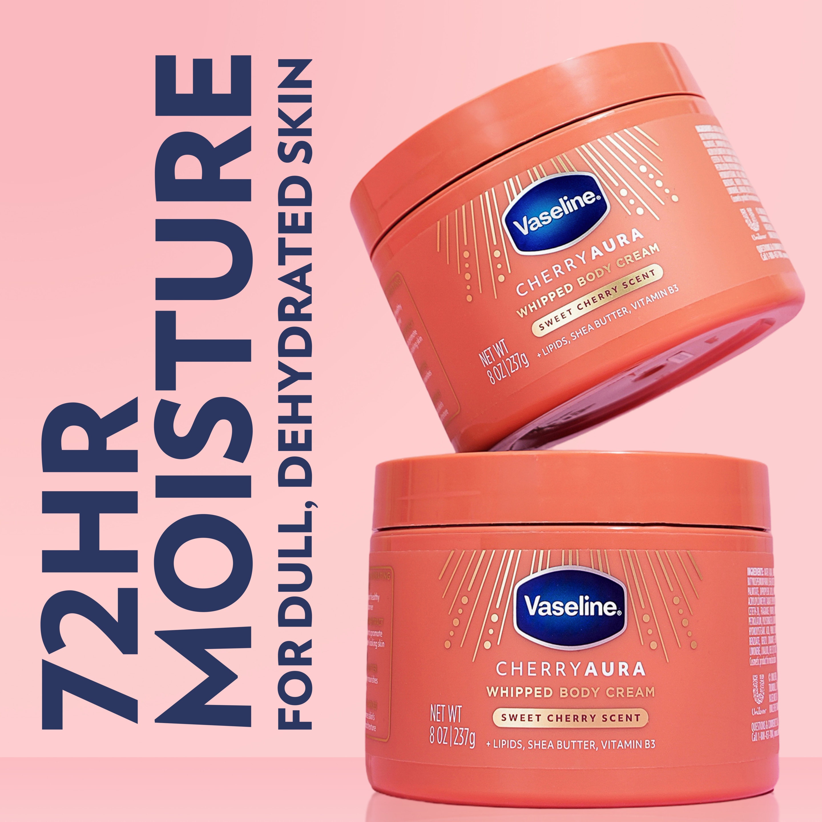 Two jars of Vaseline Cherry Aura Whipped Body Cream are displayed on a pink background, with text