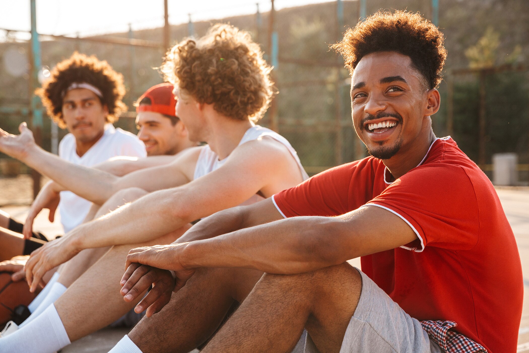 Young guys who know how to cool down after playing sport in summer