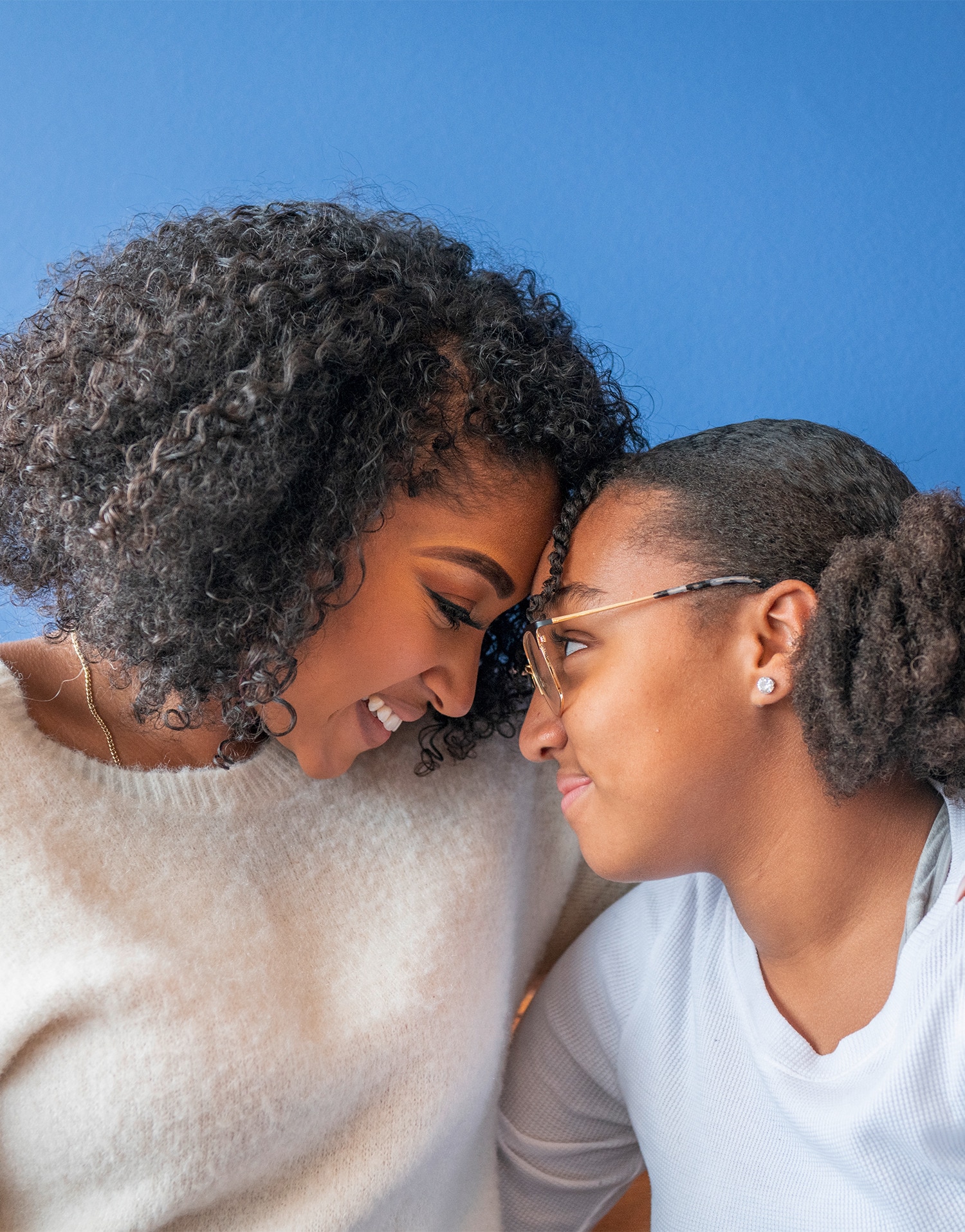 Mother and daughter smiling 