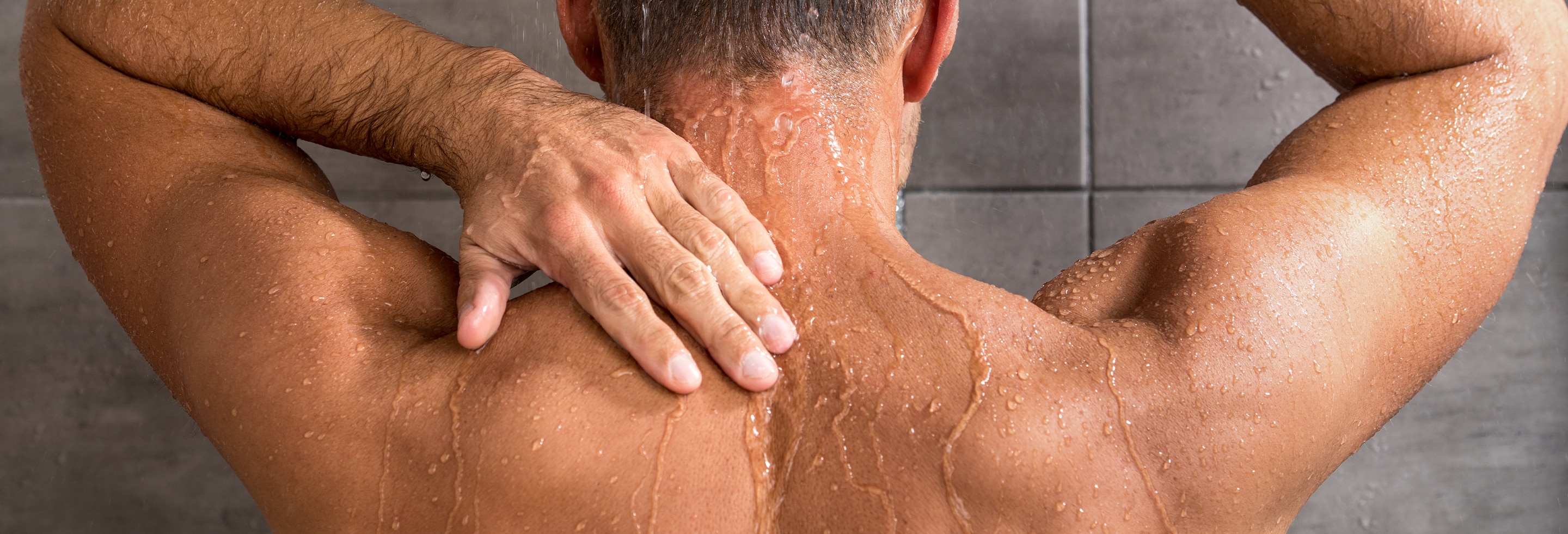 Man skin purging in the shower