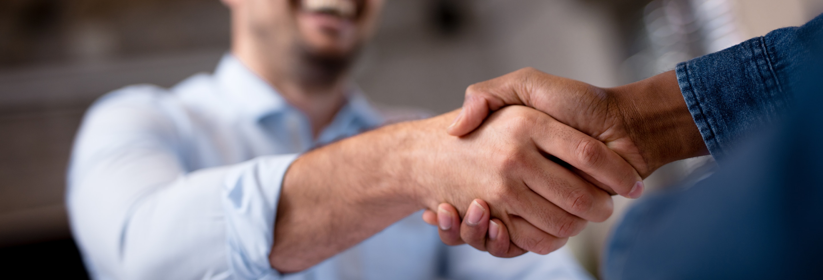 Two men shaking hands with no sign of sweaty hands