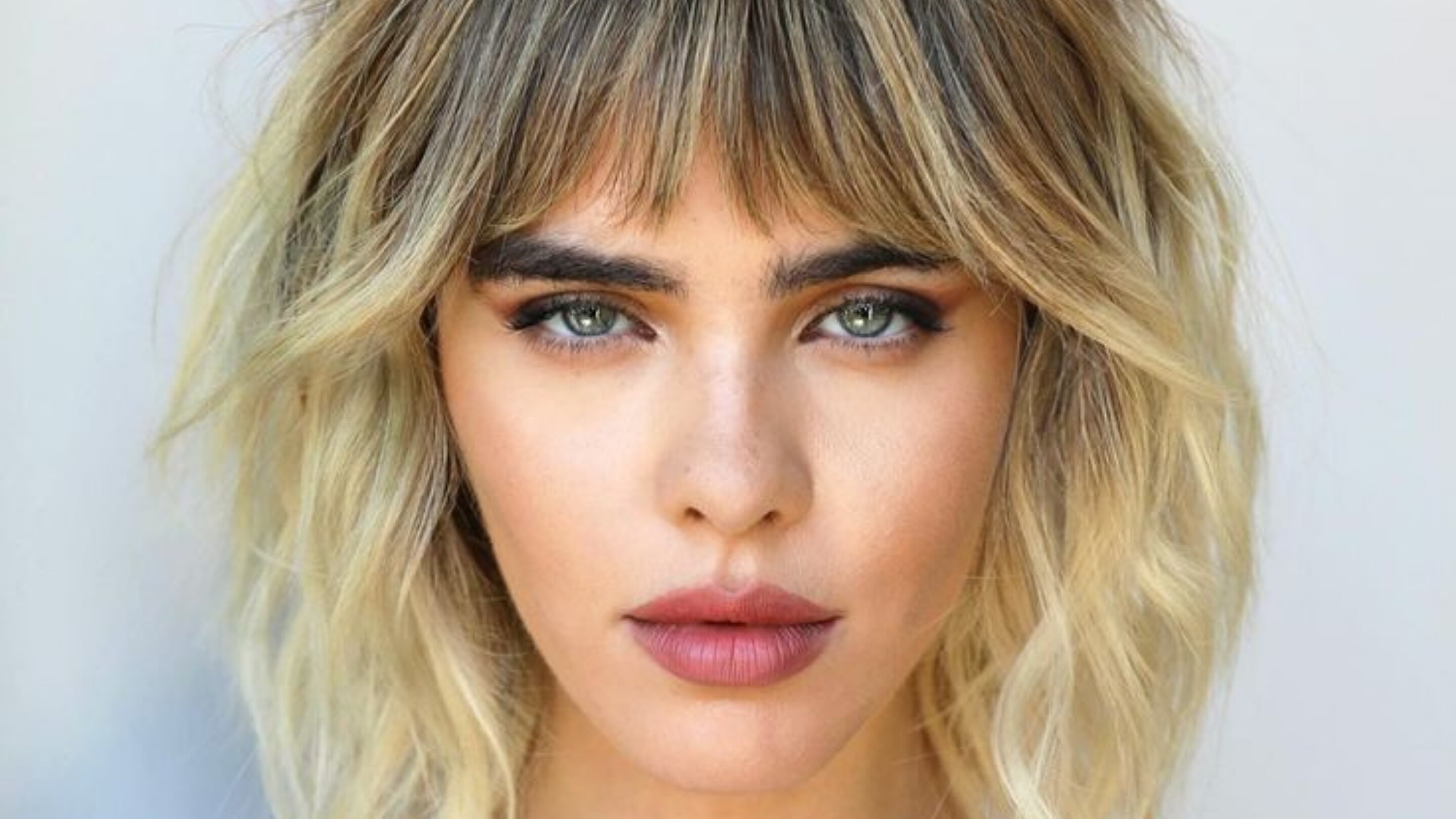 8. Short Step Cut with Bangs