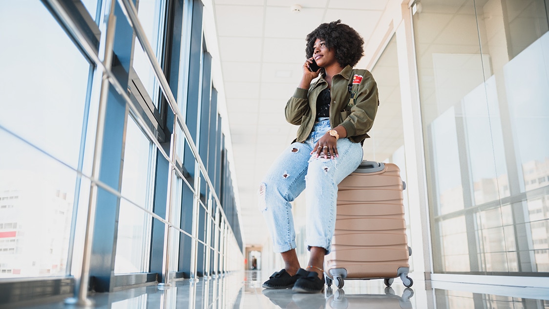 Woman waiting at the airport, staying fresh with whole body deodorant