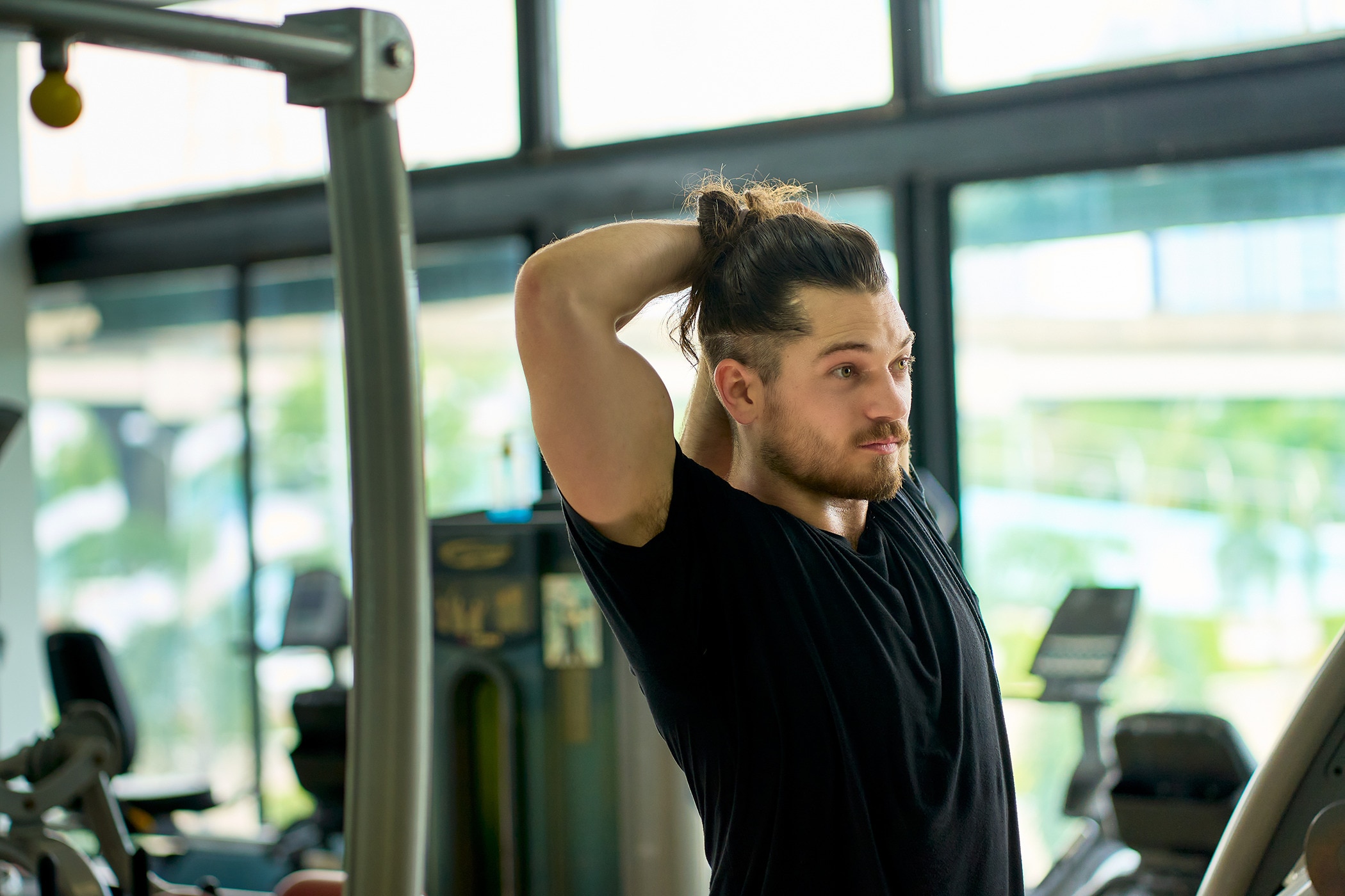 Young man with salty skin after sweating at gym