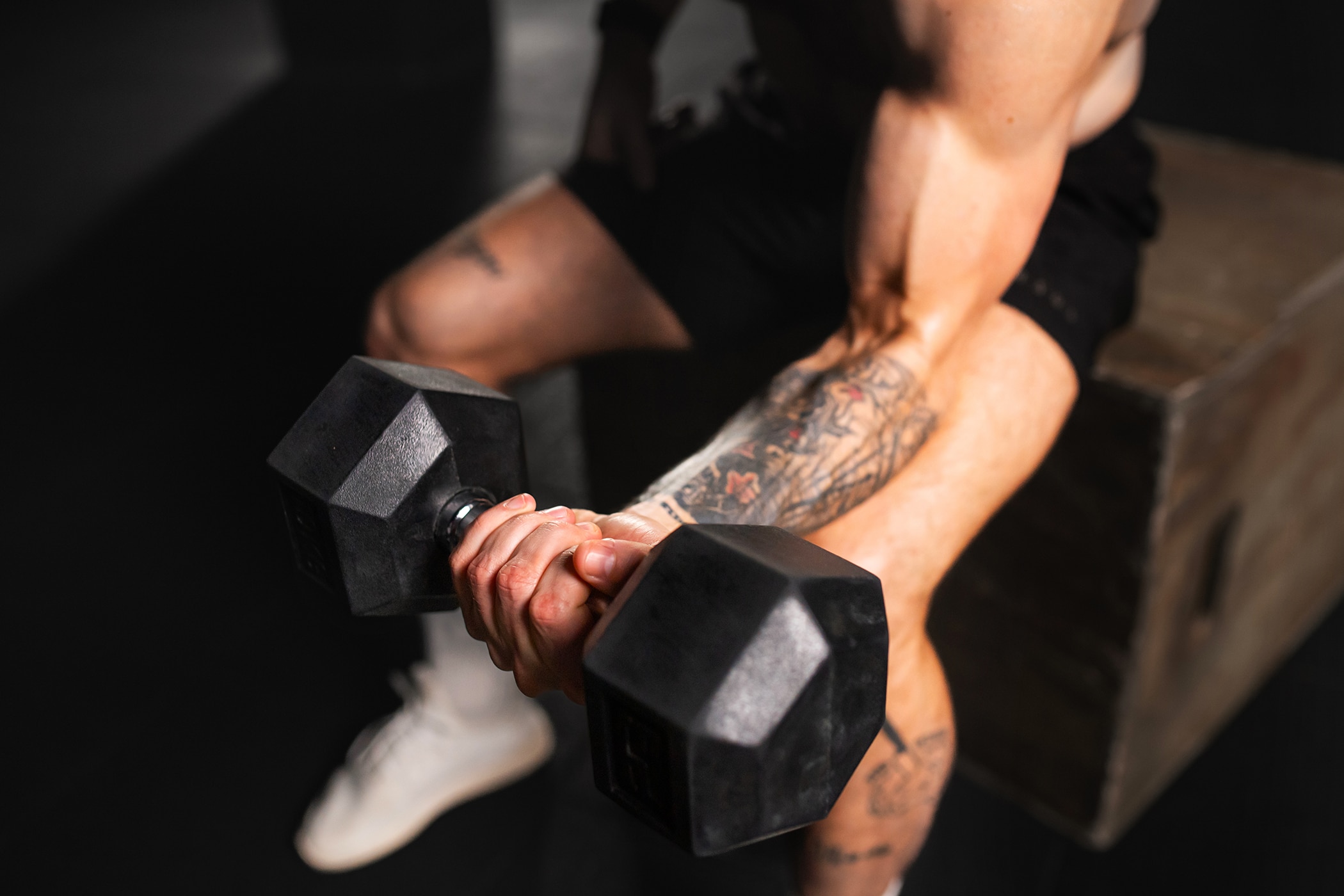 Man protecting his tattoo whilst he works out
