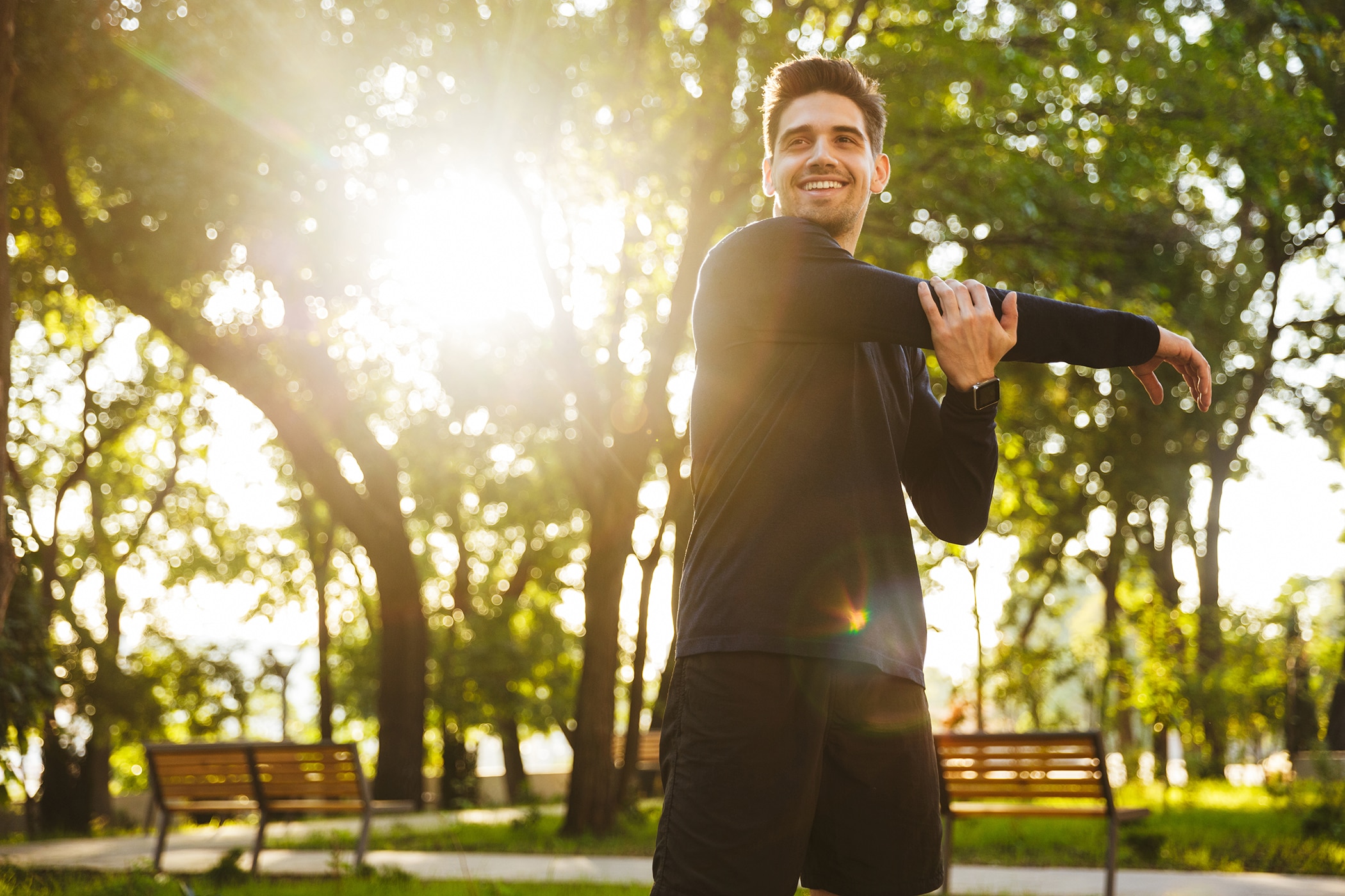 Man stretching before his morning workout routine