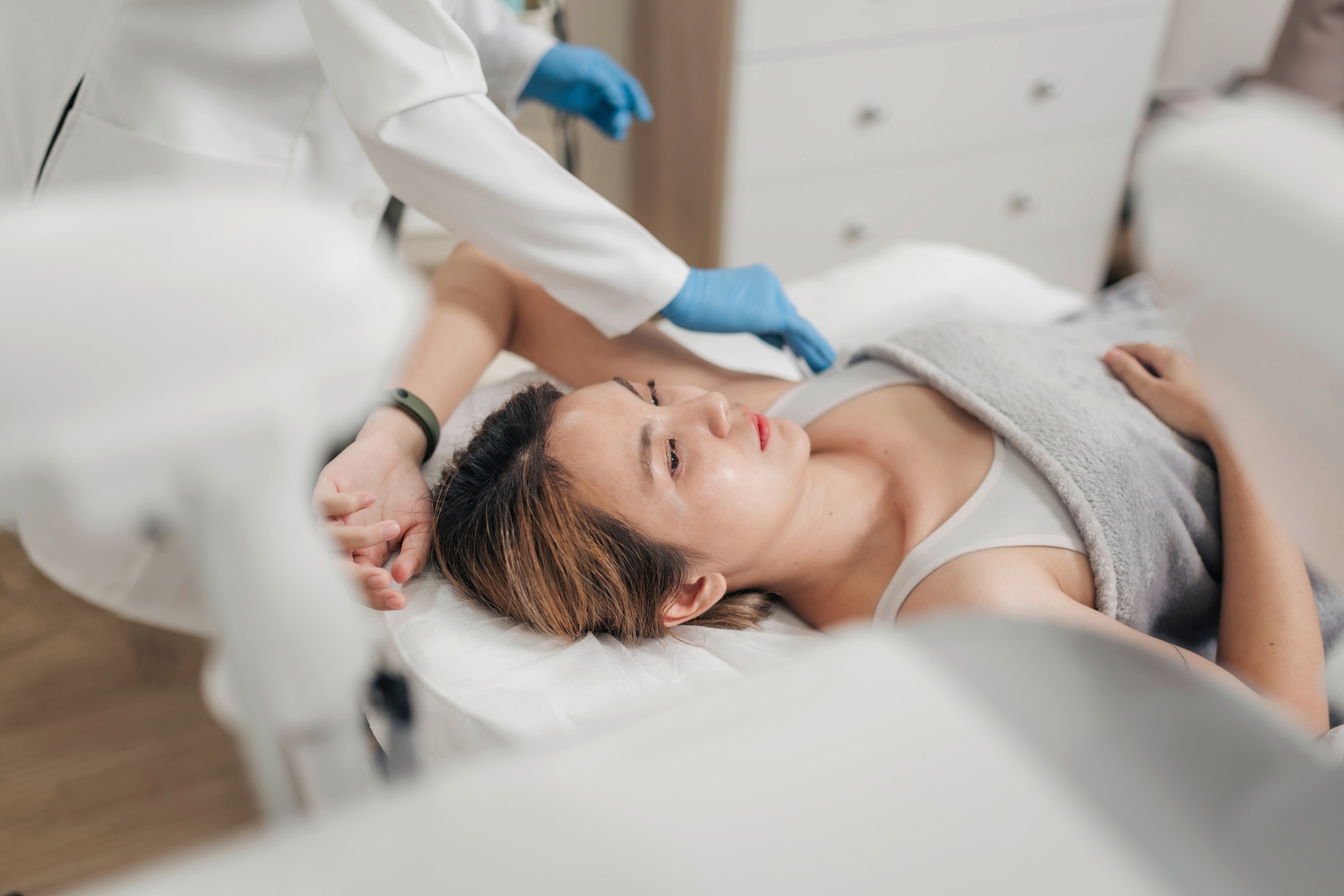Woman getting an underarm treatment.