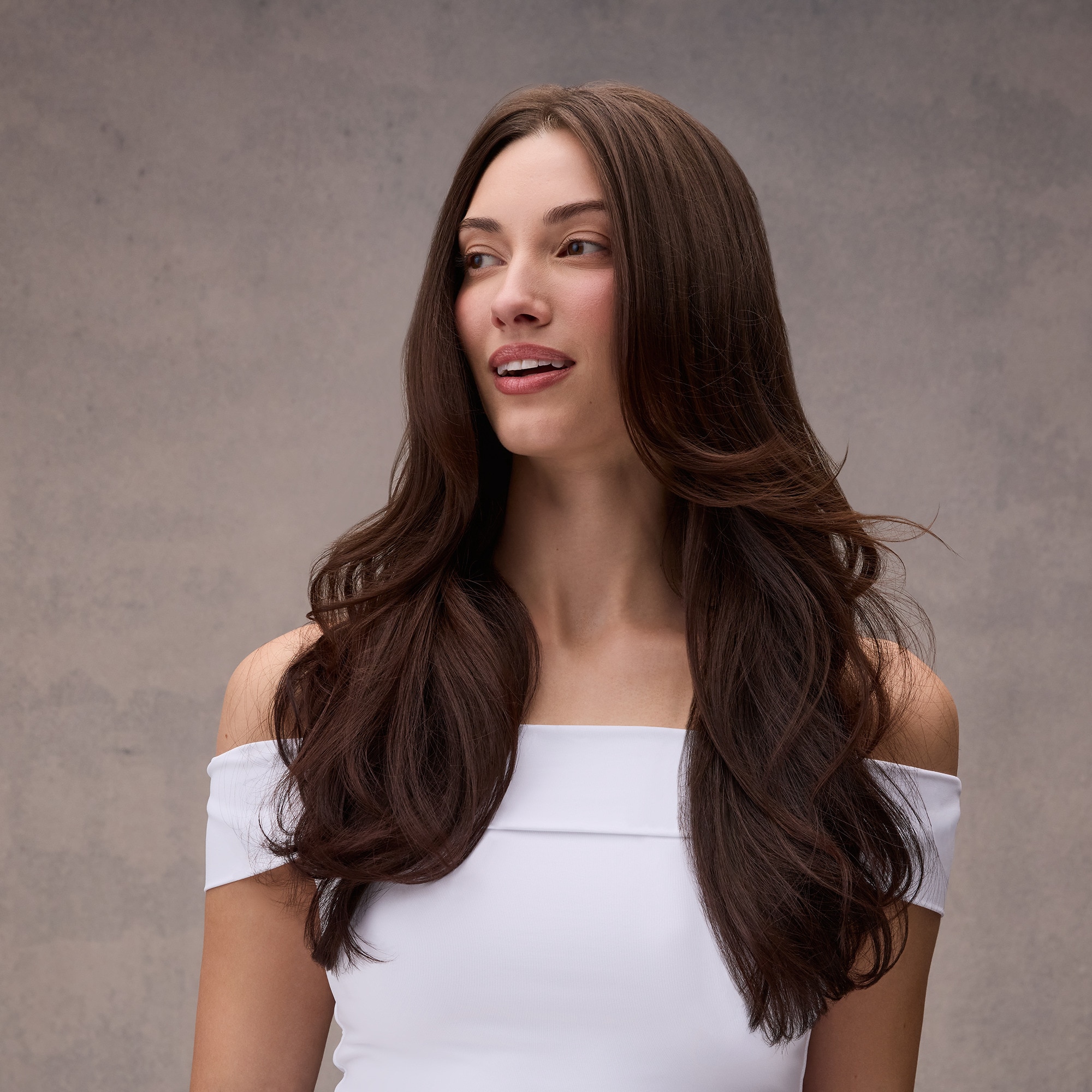 Woman with long, glossy color-treated hair