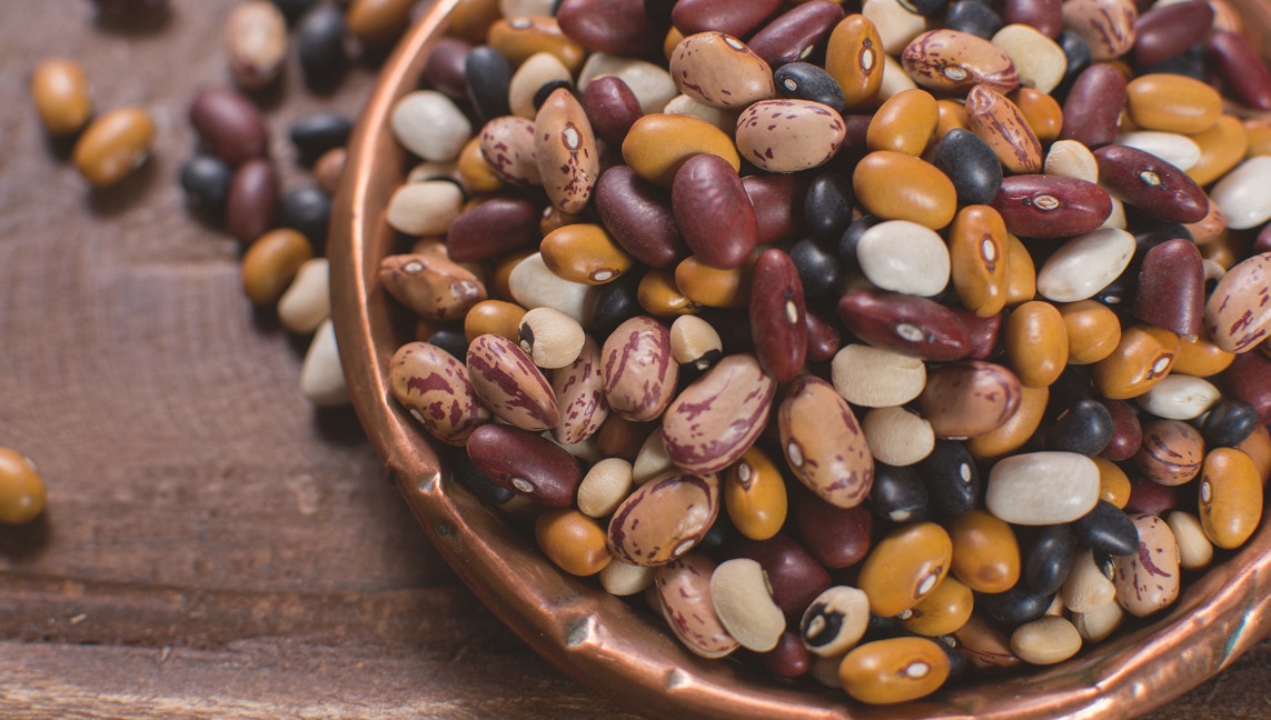 Mixed beans in a wooden bowl